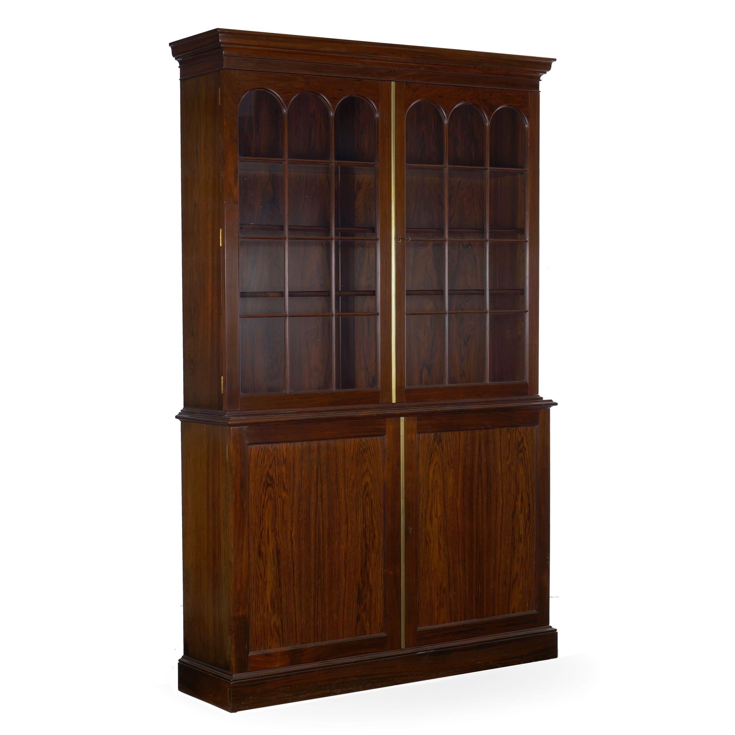 A very fine reproduction of the George III taste using rich and exotic rosewood veneers and solids to create a dramatic display, 20th century the cabinet is exquisite in quality and material, the rich and dense rosewood polished to a near