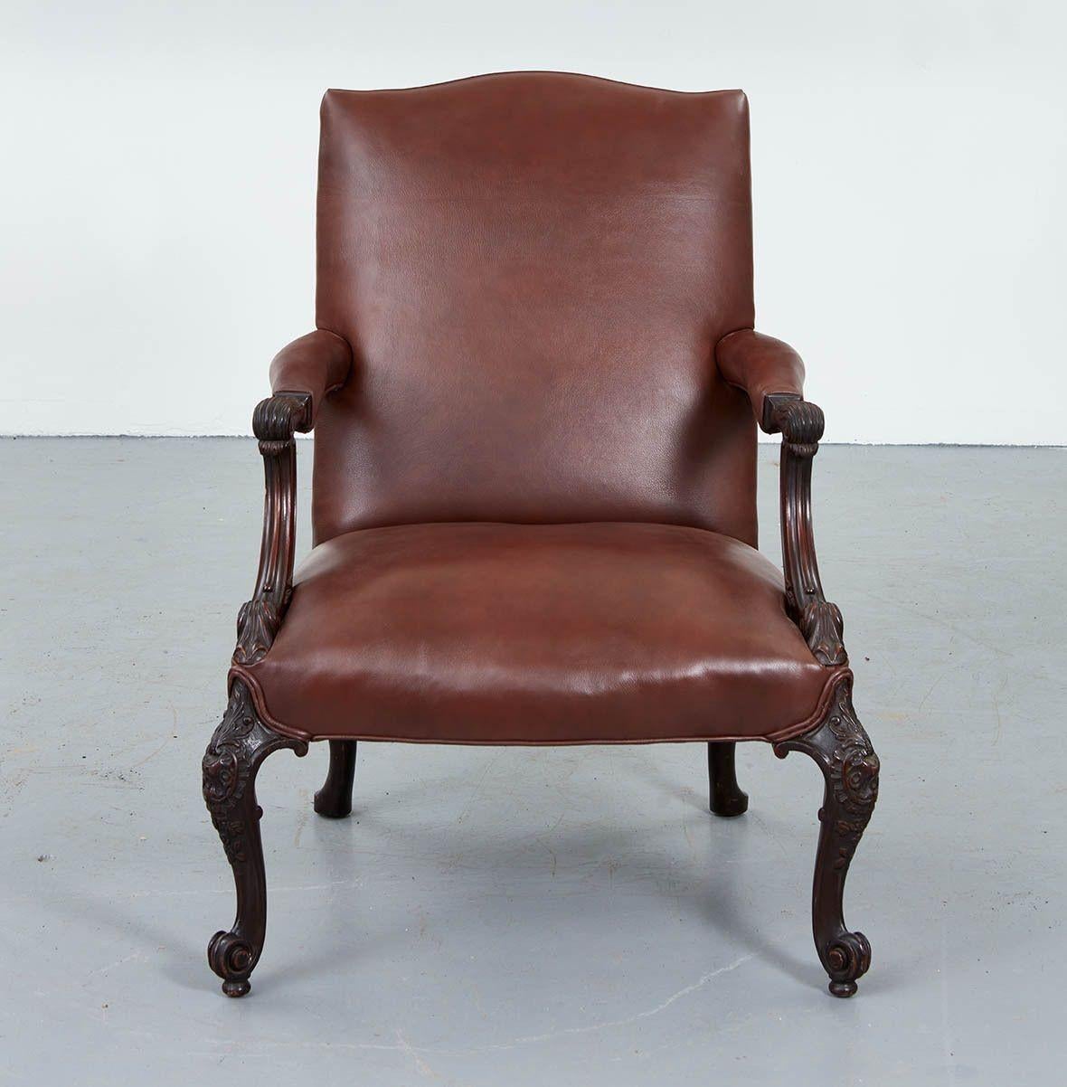 Fine Georgian style carved mahogany Gainsborough armchair of generous scale, the shaped back over padded arms with acanthus leaf scroll carving over upholstered seat, the well carved legs with acanthus leave carved knees and scrolled feet, the whole