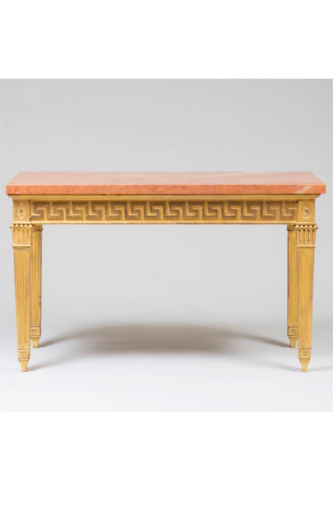 George III style giltwood and Marble console table
A handsome and authentic looking reproduction. Giltwood frame with fluted, tapered legs, Greek key apron, and rosette corners. Marble top sitting on top.
Condition: Very minor nicks to the edges of