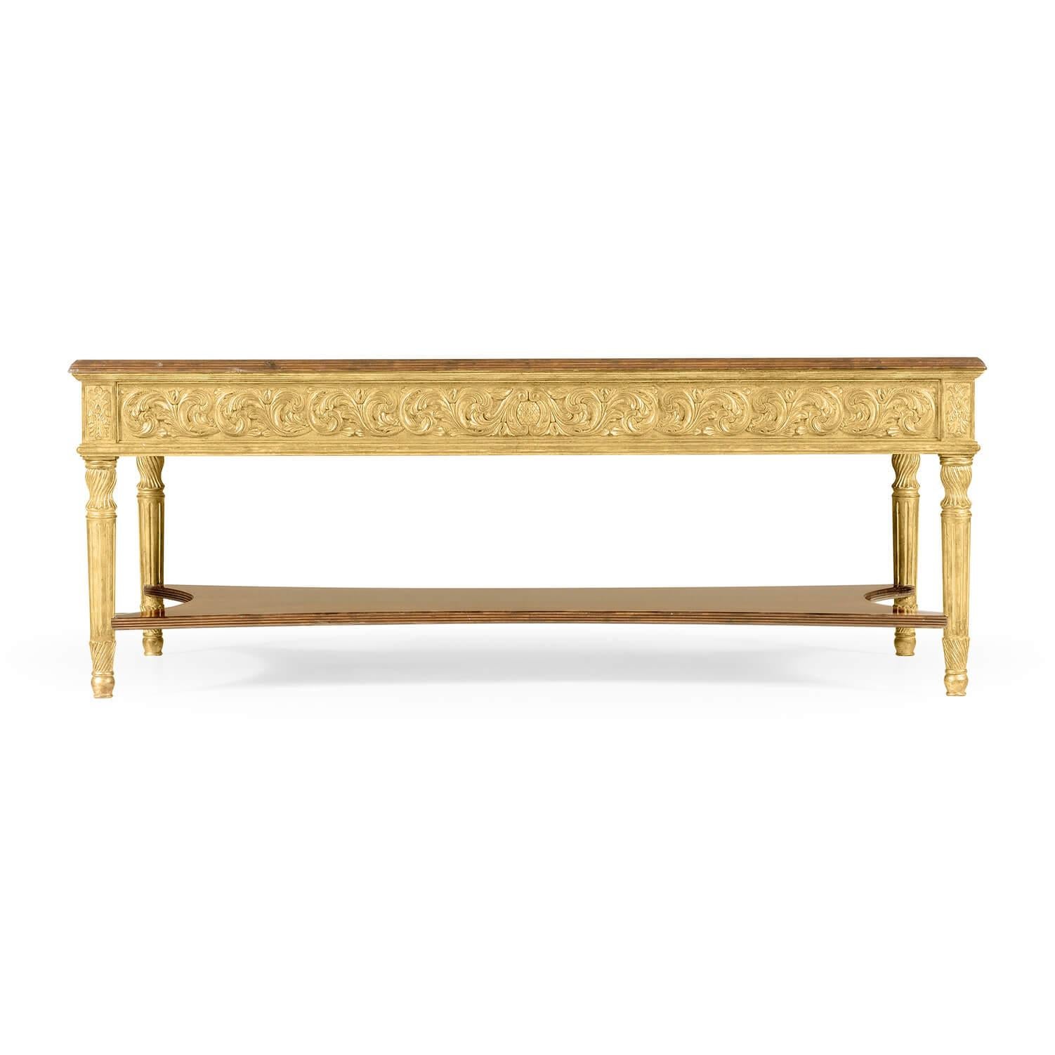 A fine George III style rectangular coffee table, the satinwood top with fine running marquetry inlay set above a gilded frieze of floral motifs, further veneering to the under-tier and fluted gilt legs.

Dimensions: 54