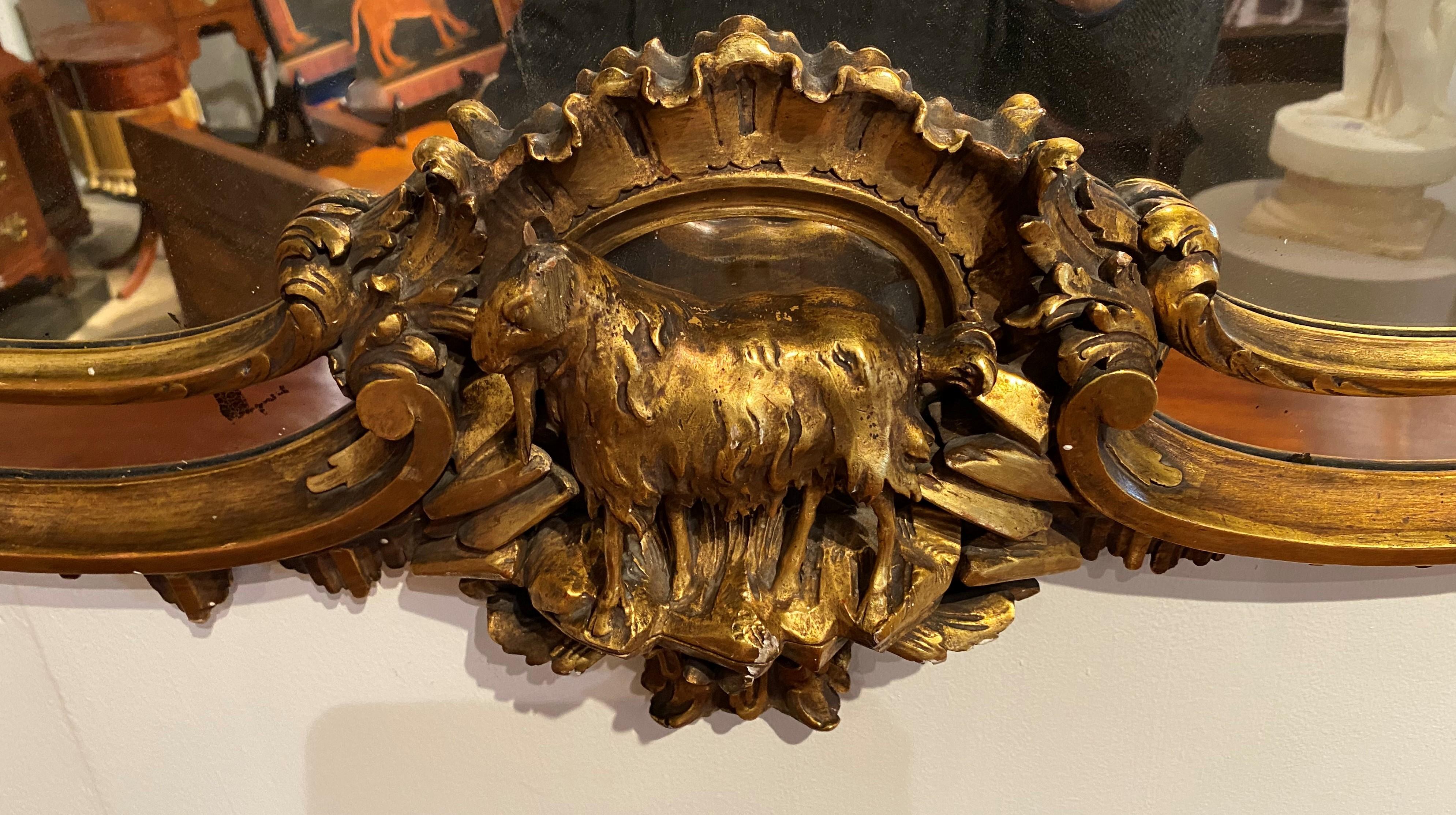 George III Style Heavily Carved Rococo Oval Giltwood Mirror with Eagle Crest In Good Condition For Sale In Milford, NH