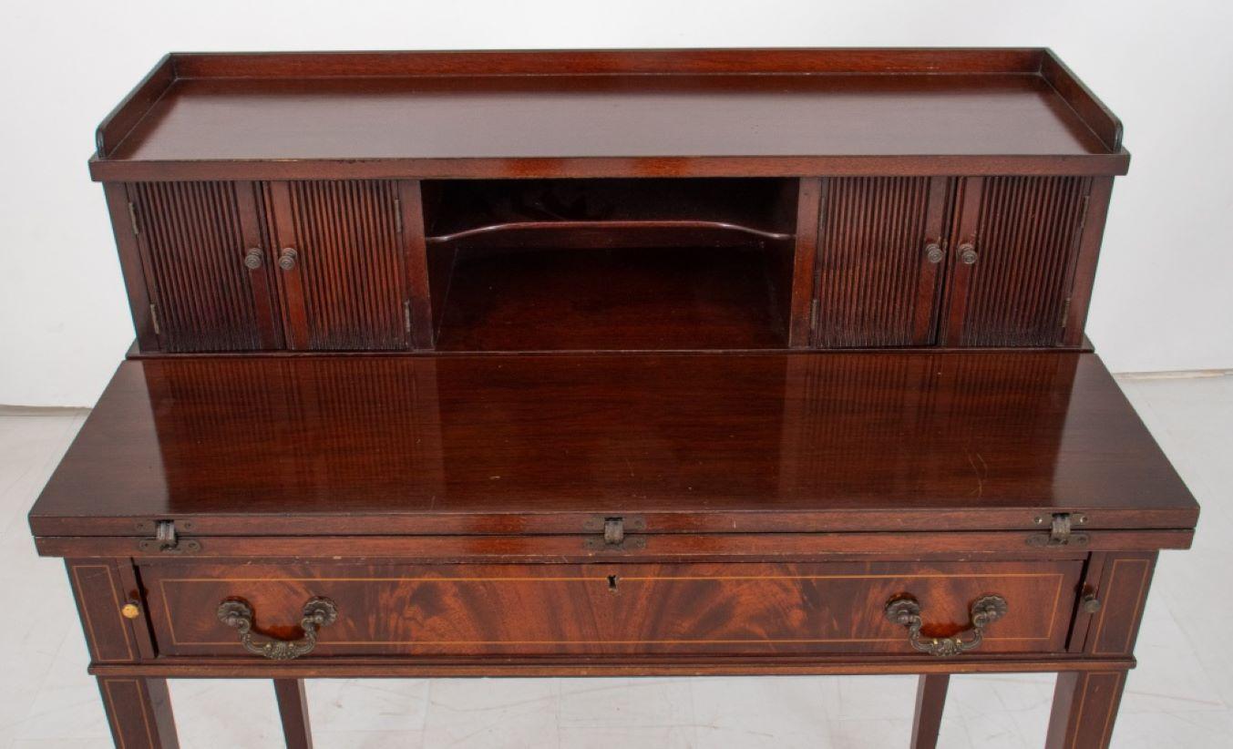 George III Style Lady's Desk, by Oxford, with upper section with galleried top and letter rack flanked by small reeded front two-door cabinets, above a drop front writing surface over a long drawer between two slides, on tapering square satinwood