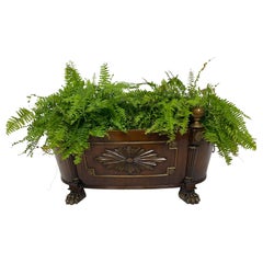 English Regency Style Mahogany Cellarette with Brass Sunburst Mount and Paw Feet