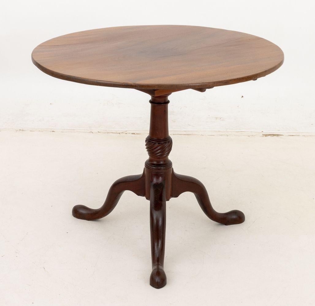George III Style Mahogany Birdcage Tilt-Top Table, the central turned wood support and three cabriole legs. 27