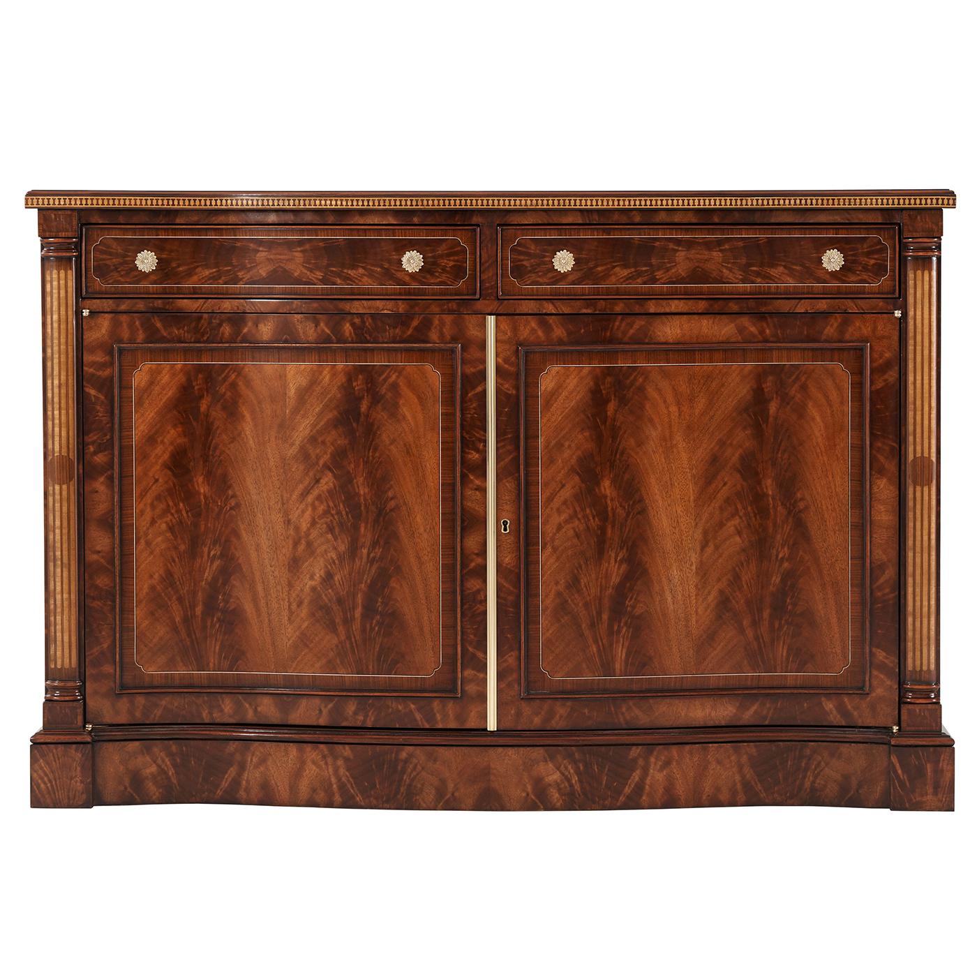 A fine George III style flame mahogany and morado banded side cabinet with fine double stringing throughout, the serpentine top with a parquetry edge above two panel inlaid drawers with floral brass handles, above two paneled doors enclosing an