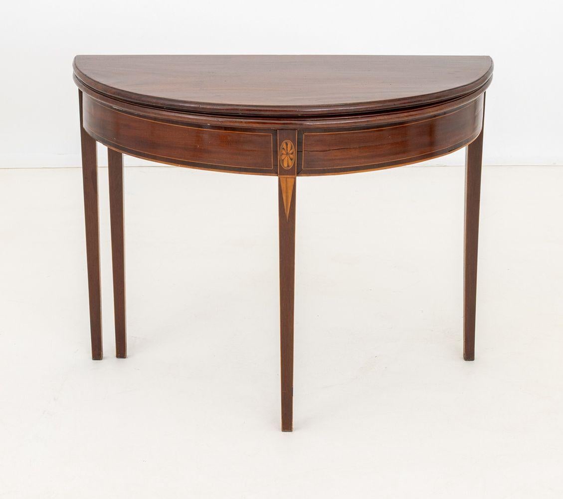 George III Style Mahogany and Marquetry D-Shaped Card Table, early 20th century, the flip-top and gate leg opening to a round top on four tapered legs. Closed state: 28.5
