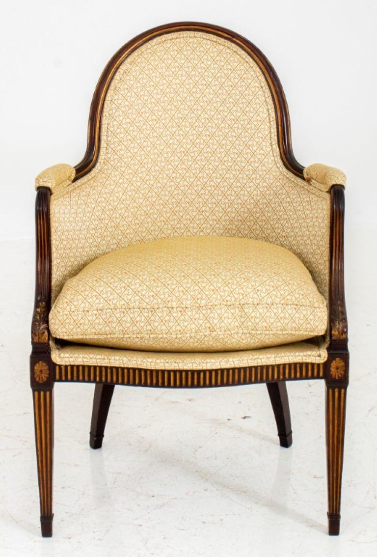 George III Style Mahogany Desk Chair in the Hepplewhite manner with spoon back seatrail above upholstered back and seat with down swept volute arms above a fluted shaped seatrail with paterae-headed tapering square fluted legs and rear sabre legs.
