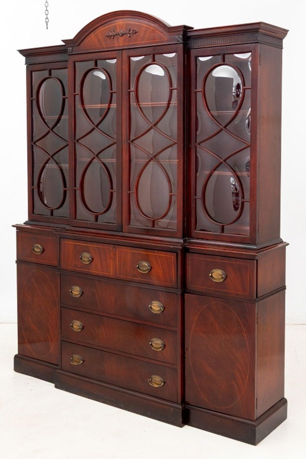 George III Style Mahogany Breakfront Secretaire Bookcase, 20th century, the arched pediment above four astragal glazed doors enclosing adjustable shelves, below a central secretaire drawer, with a fitted interior, three long drawers below flanked by
