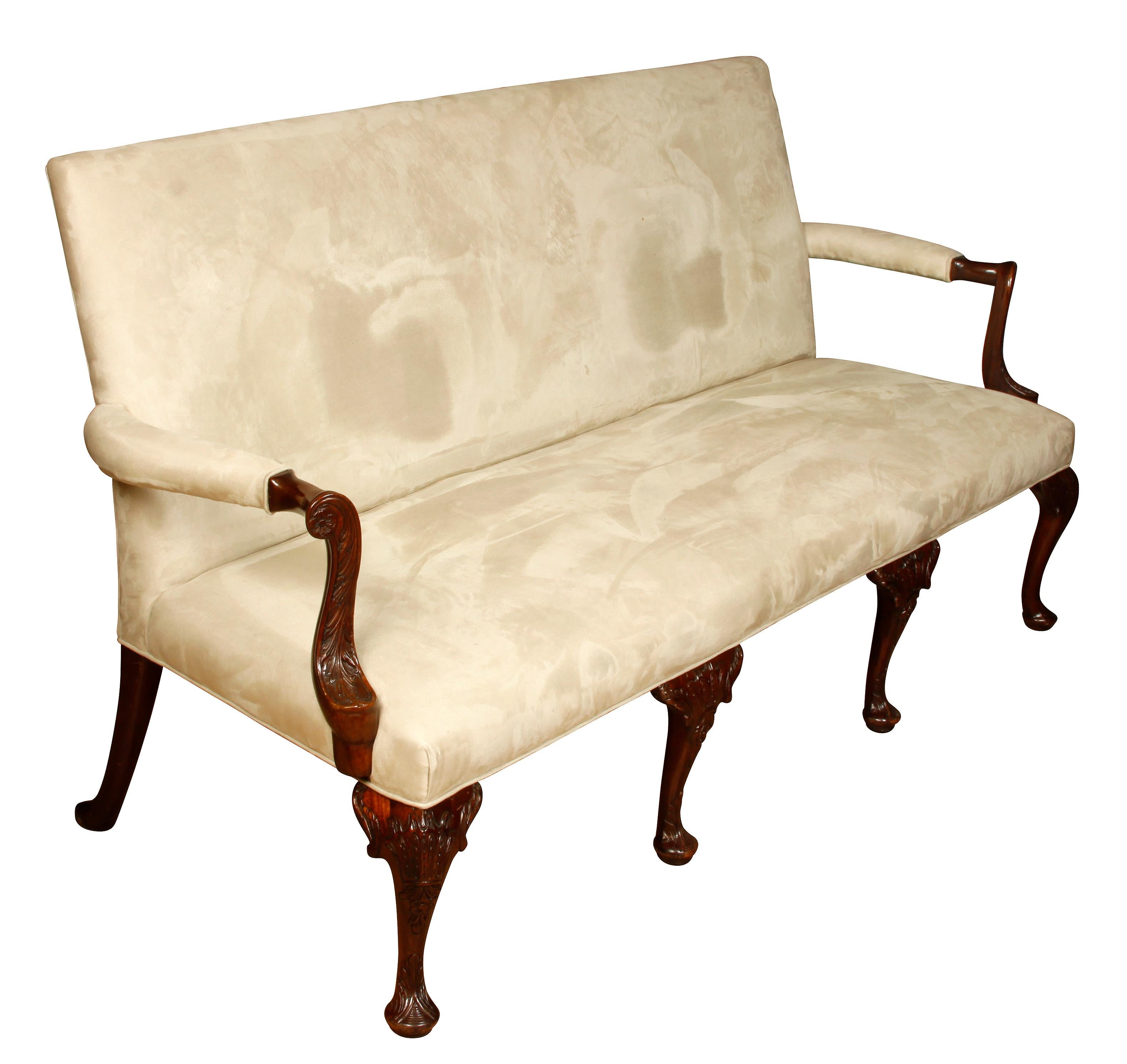 George III style mahogany settee in suede with carved arms and legs.