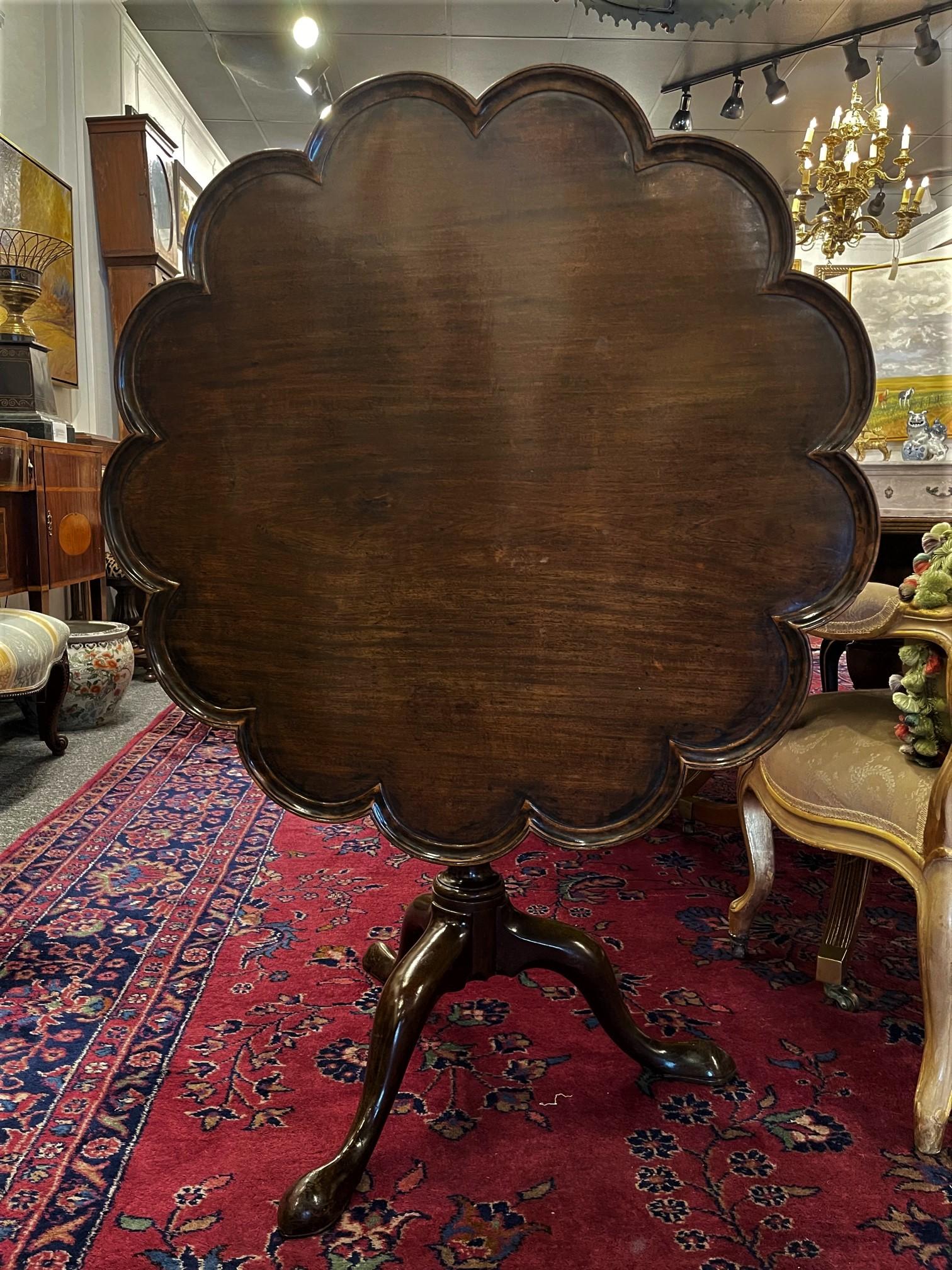 George III style mahogany tilt top or tripod scalloped edge and bird cage table, 19th century.