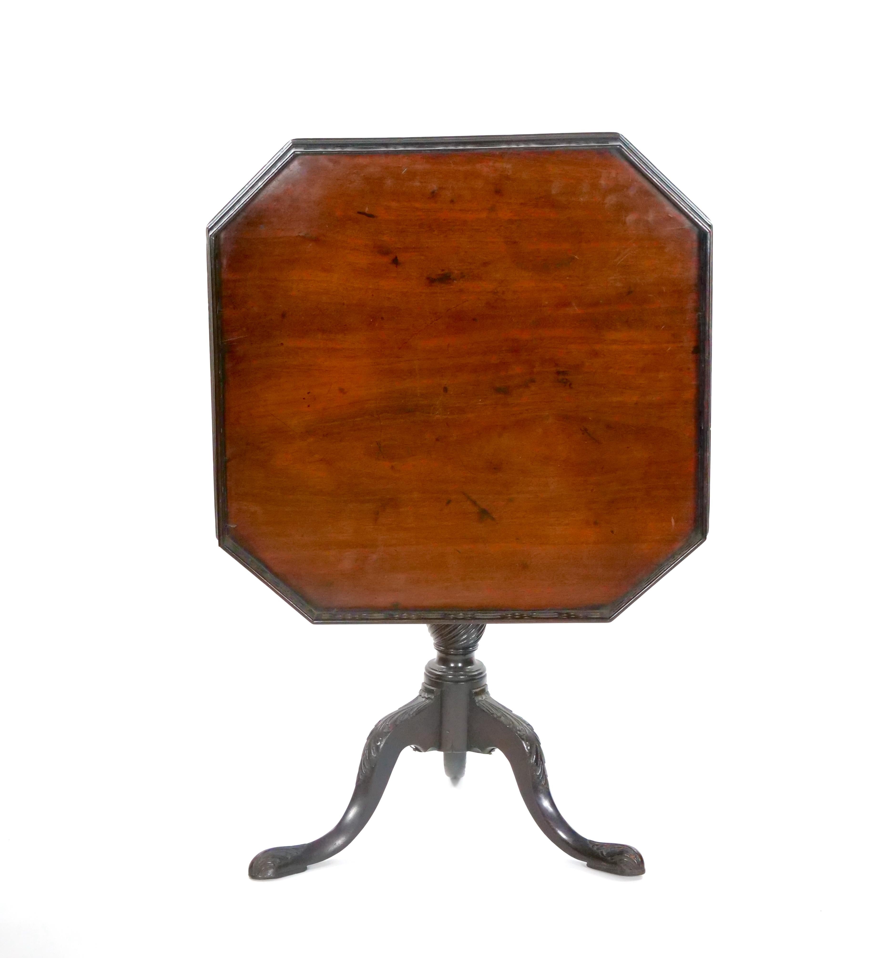 Immerse your living space in the timeless charm of the 19th Century Mahogany Wood George III Style Octagonal Tilt-Top Table. This exquisite piece is a testament to the enduring elegance of the George III style, meticulously crafted with attention to