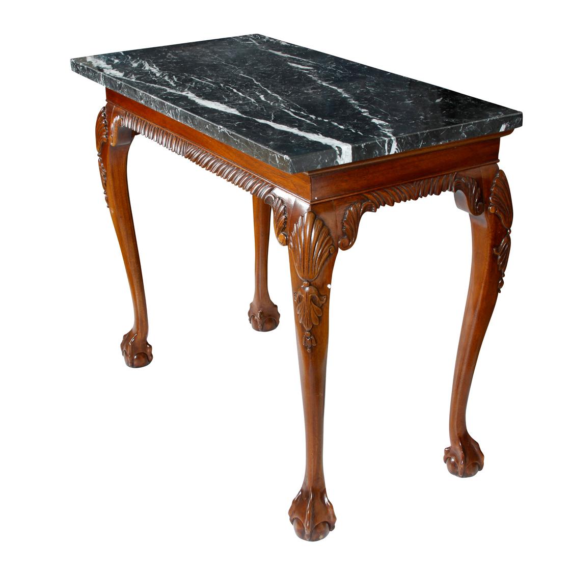 George III style walnut console with black marble top and ball and claw feet.