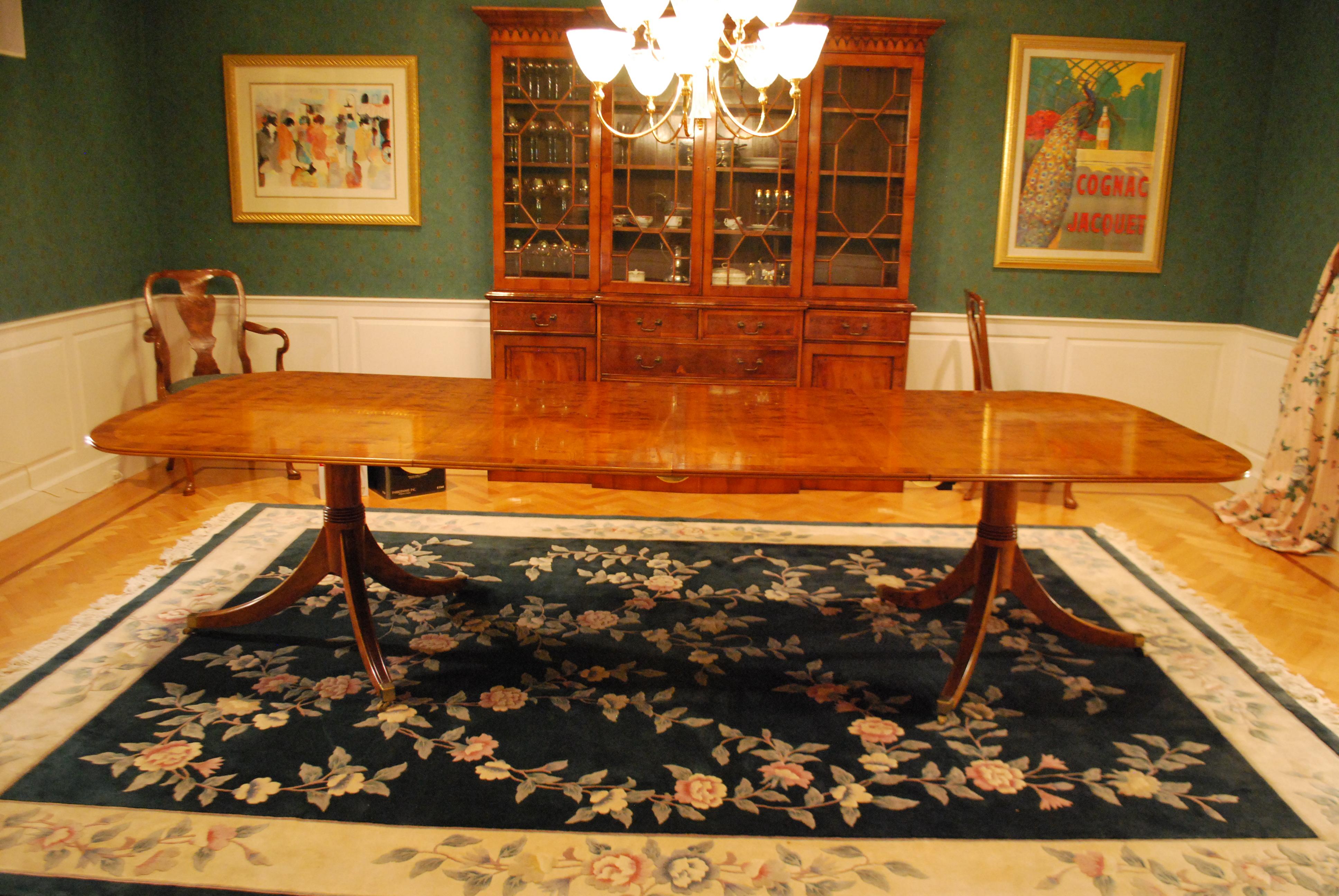 George III style pedestal table, made in Yewood by Mill House Antiques reproductions, 1992. This is a beautiful reproduction dining table in mint condition. This is priced to sell, because of a move. Surface of the table is in excellent shape. No