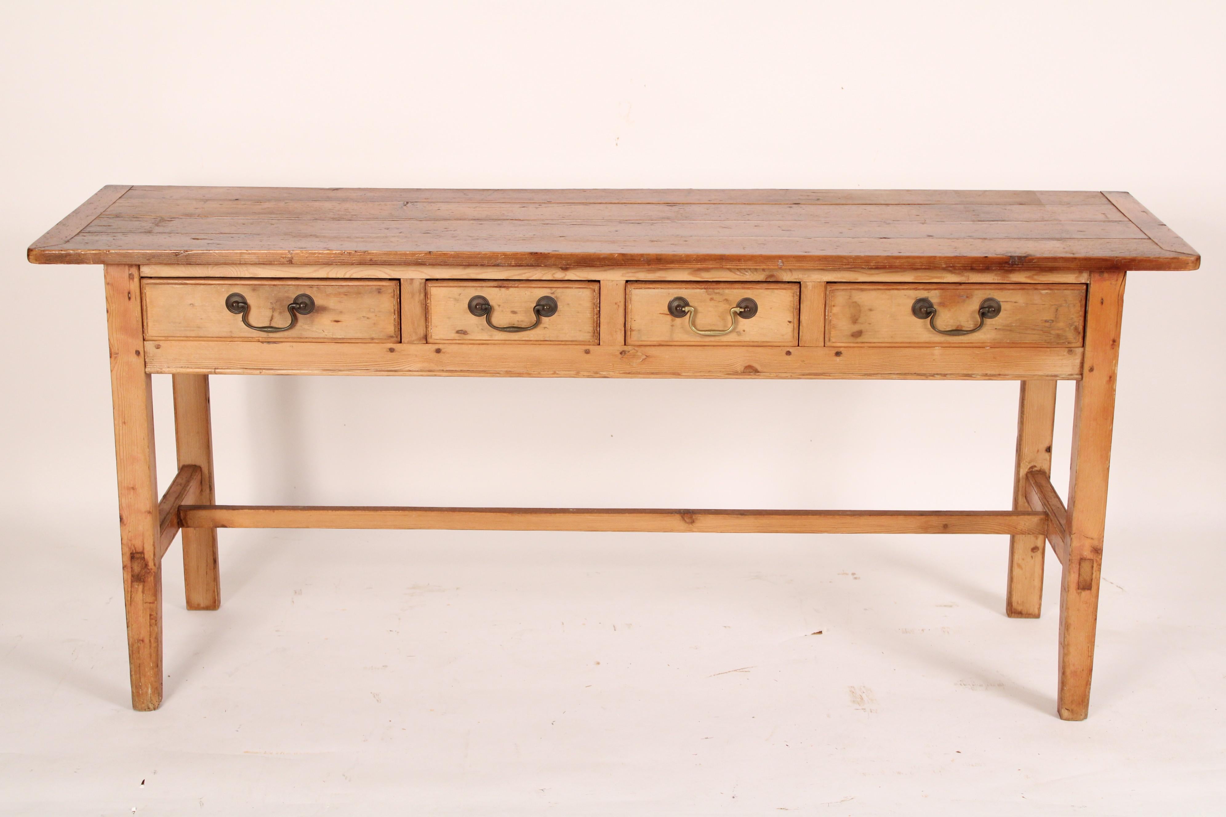 George III style pine sideboard, made from antique and later elements. Assembled circa 1960's. With a rectangular overhanging top, 4 frieze drawers, resting on straight back legs and square tapered front legs joined by an H shaped stretcher bar. Peg