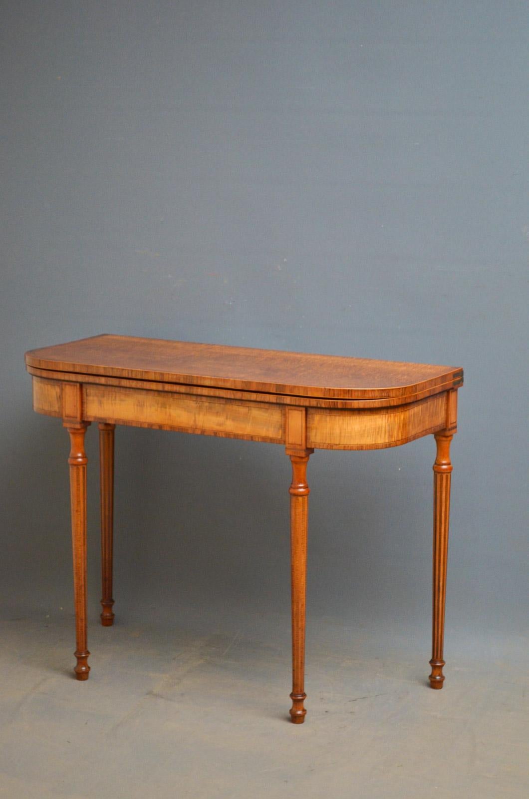 Sn4453 fine quality Georgian, fiddle back sycamore D shape card table, having fold over top with coromandel crossbanding to edge above crossbanded frieze, flanked by string inlaid panels, standing on slender, turned and inlaid legs. This antique