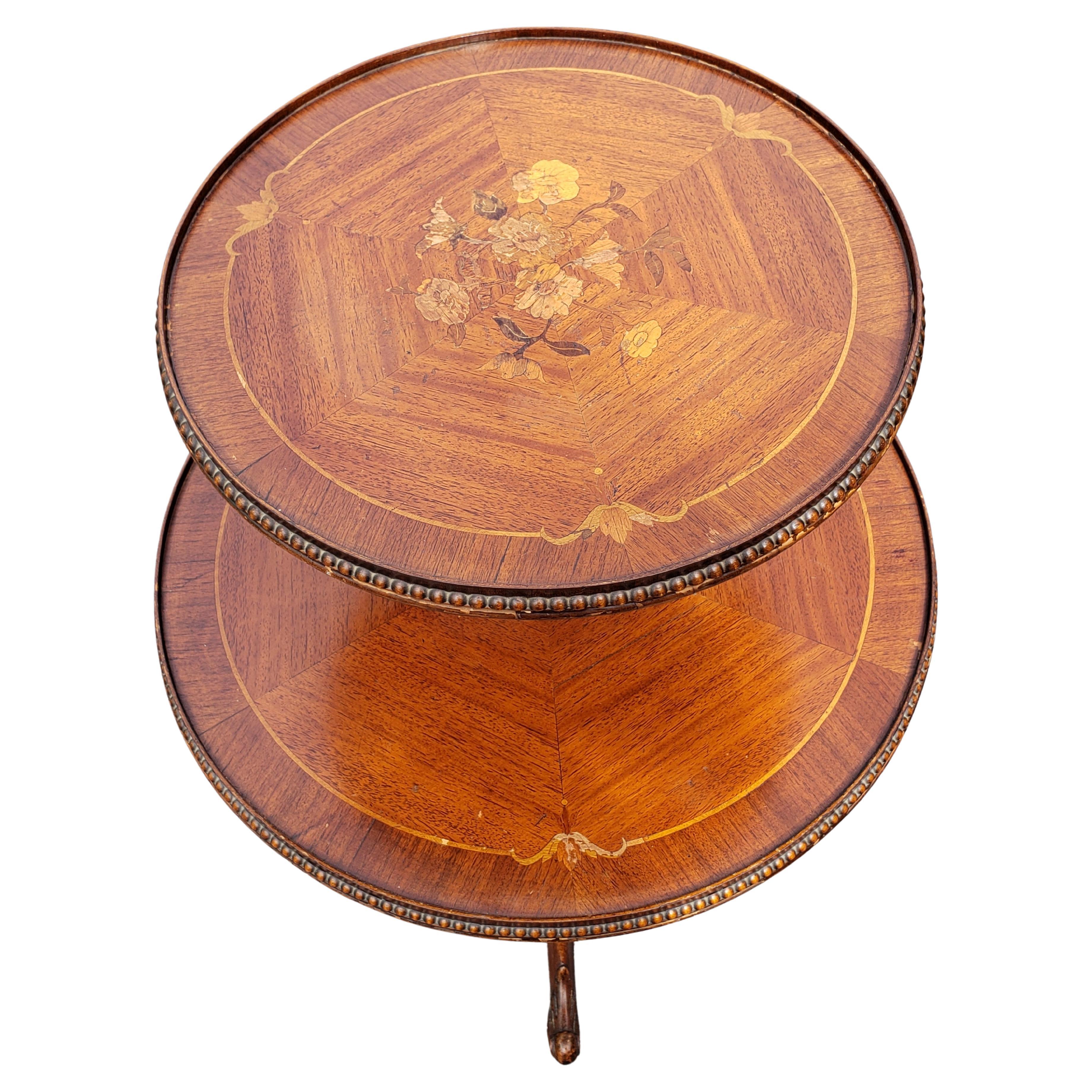 Exquisite George III style two-tier mahogany and walnut dumpwaiter with fine satinwood and kingwood flower inlays, fine Italian style marquetry work with beaded edges. 
General good antique condition.


W6052622.