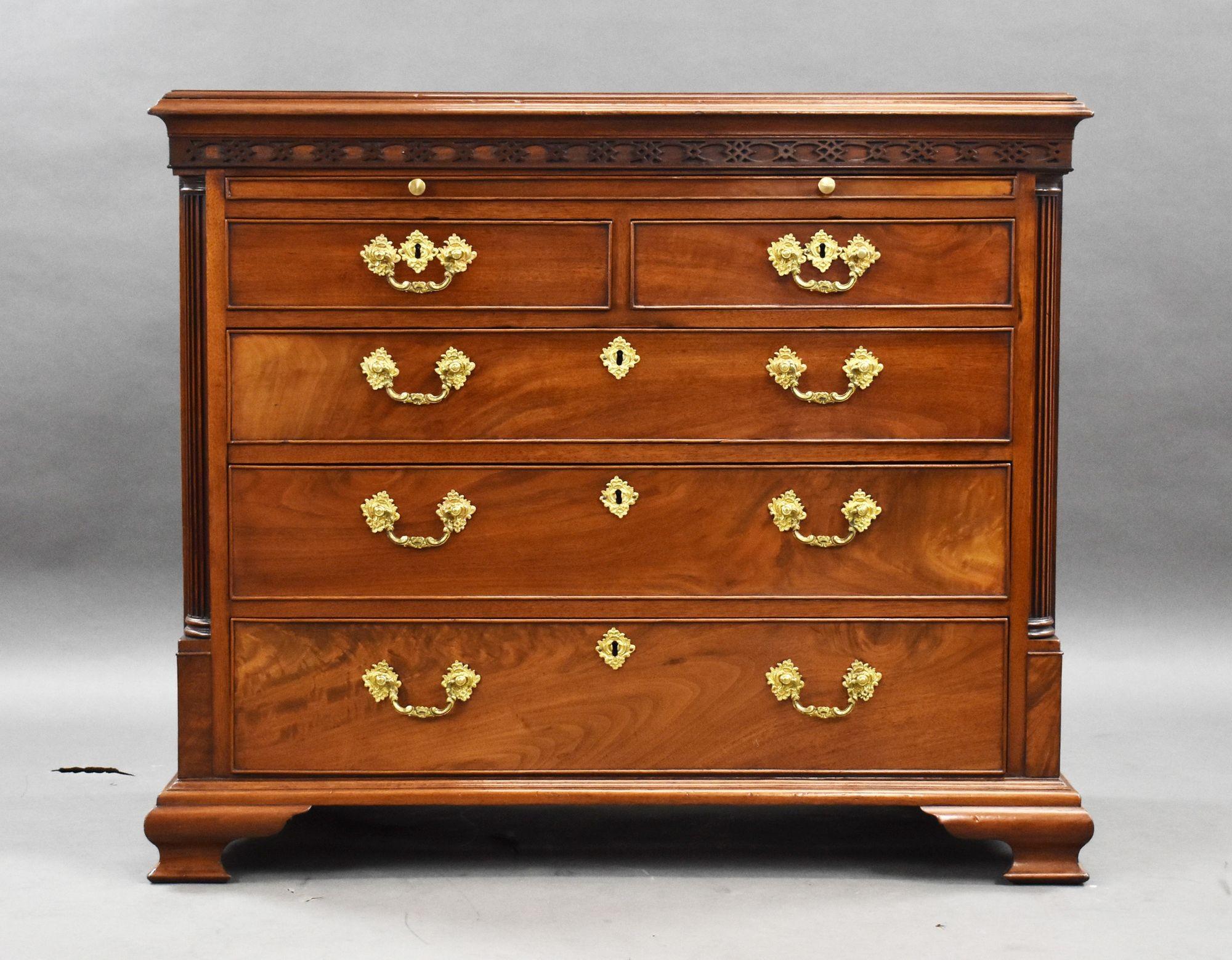 For sale is a good quality George III walnut chest of drawers, of unusual form, having a brushing slide above two short over three long drawers, each with ornate brass handles, raised ogee bracket feet. The chest remains in very good condition,
