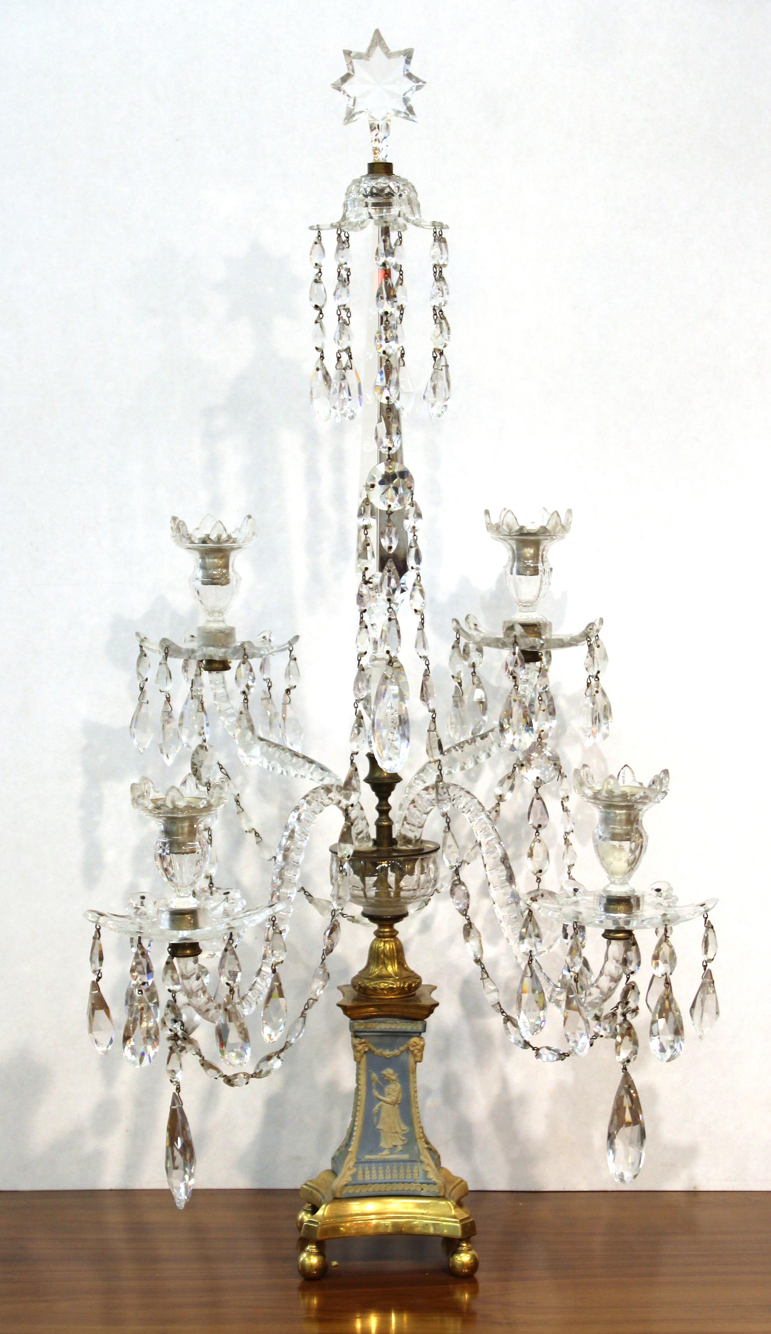 English George III period pair of four light candelabra girandoles attributed to William Parker. The pair has gilt bronze bases with Wedgwood jasperware four-sided plinths in neoclassical revival designs likely provided by Lady Templeon to Wedgwood