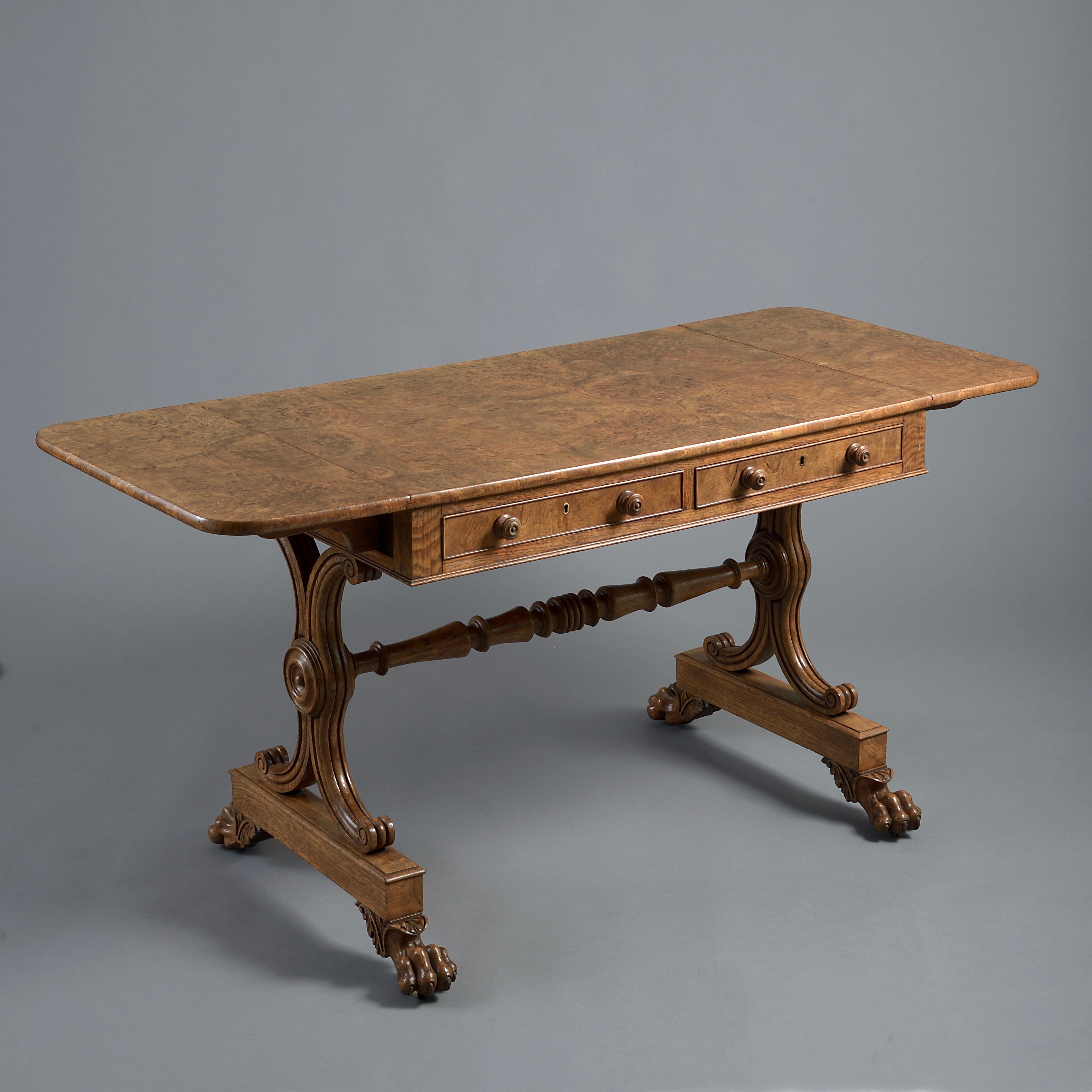 A fine George IV burr oak sofa table, circa 1825.

The frieze with a mahogany-lined drawer and dummy drawer to each side.