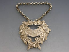 George IV Cast Silver Gilt Festooned Drapery Wine Label 'Sherry', 1829