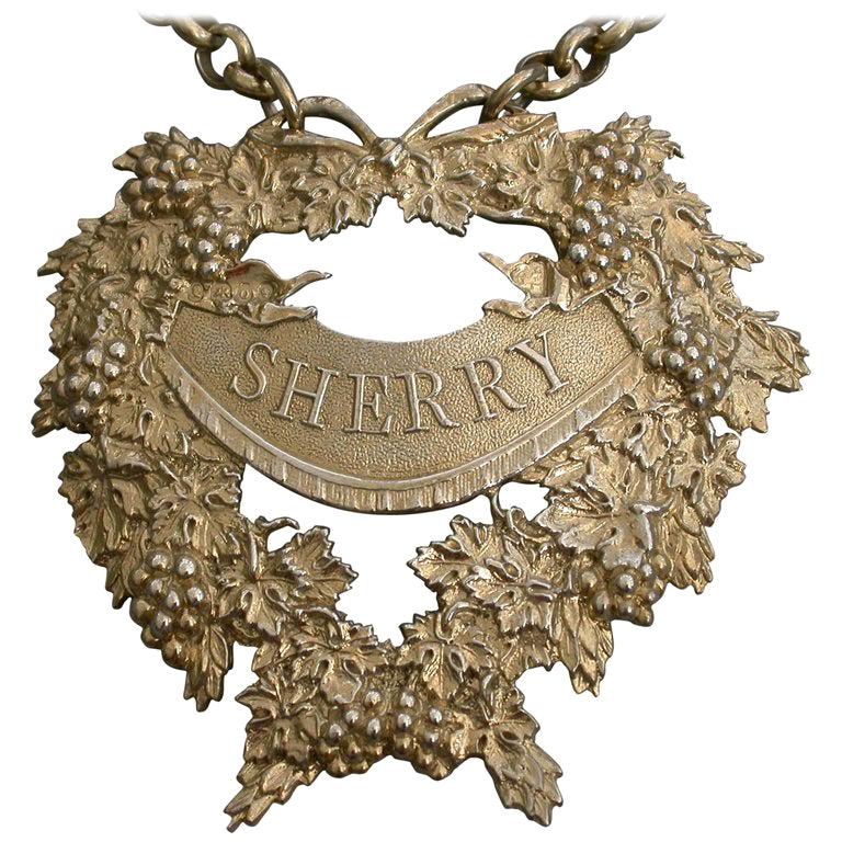 George IV Cast Silver Gilt Festooned Drapery Wine Label 'Sherry', 1829 For Sale