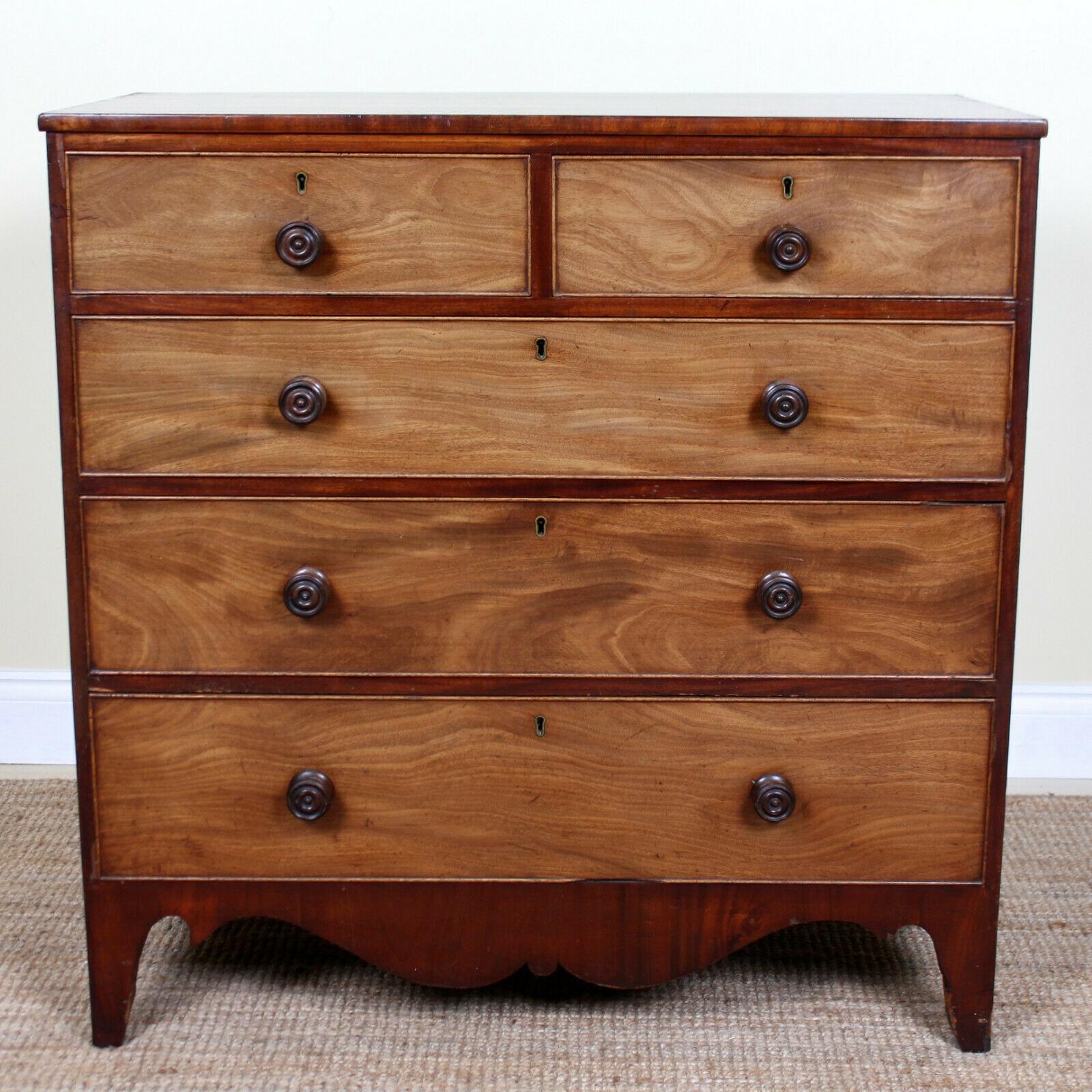 An impressive George IV period mahogany chest of drawers.
The mahogany boasting a well figured flamed grain and rich patina.
Fitted two short and three long graduated drawers with dovetailed jointing, papered interiors and mounted with good