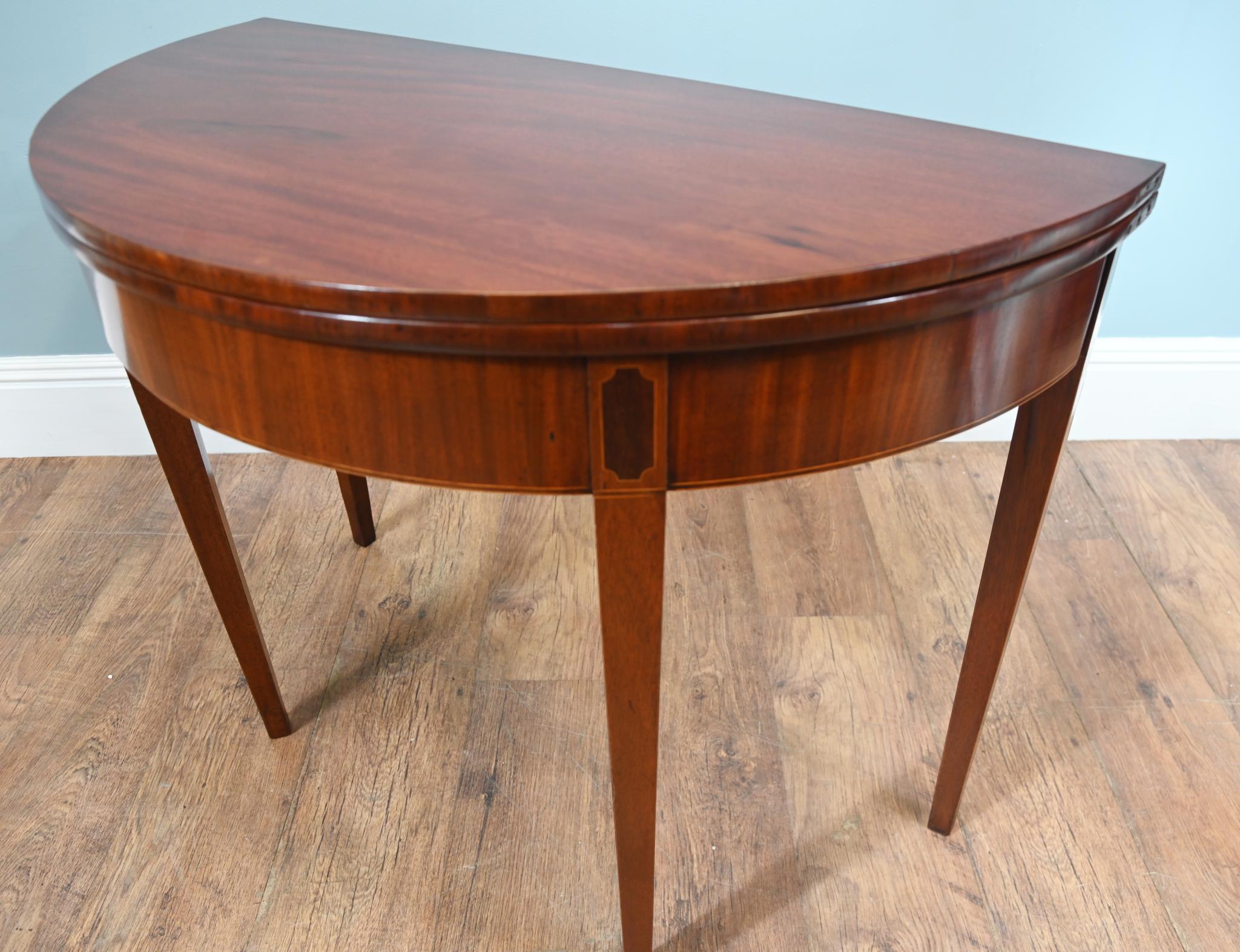 Mahogany George IV half round games table
Opens into a circle to allow you to play the game of choice
Elegant oval inlays at the top of the legs
Sheraton style Legs
Also ideal for use as a tea or console table
Dating to Circa 1830 from the George IV