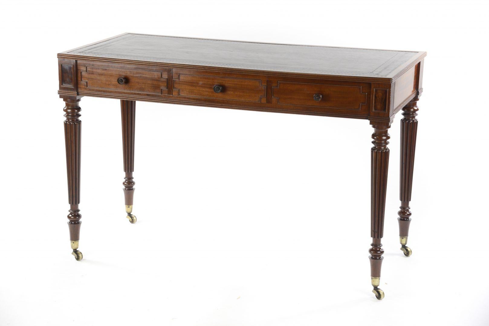 George IV Gillows mahogany writing table circa 1825, fitted with two dummy draws and one central draw, signed Gillows of Lancaster.

Gillows of Lancaster and London, also known as Gillow & Co., was an English furniture making firm based in