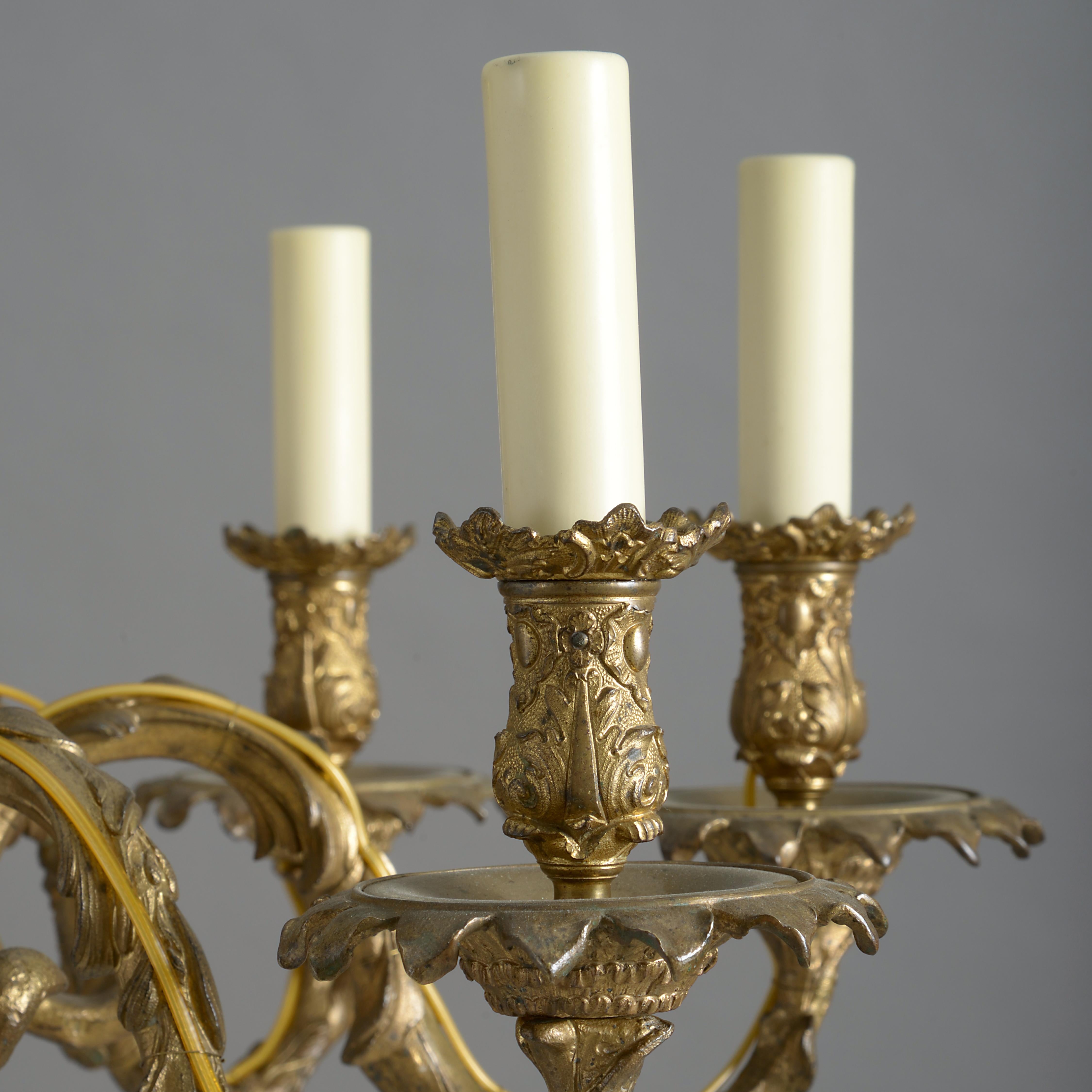 A fine George IV lacquered brass eight-light chandelier, circa 1830.
