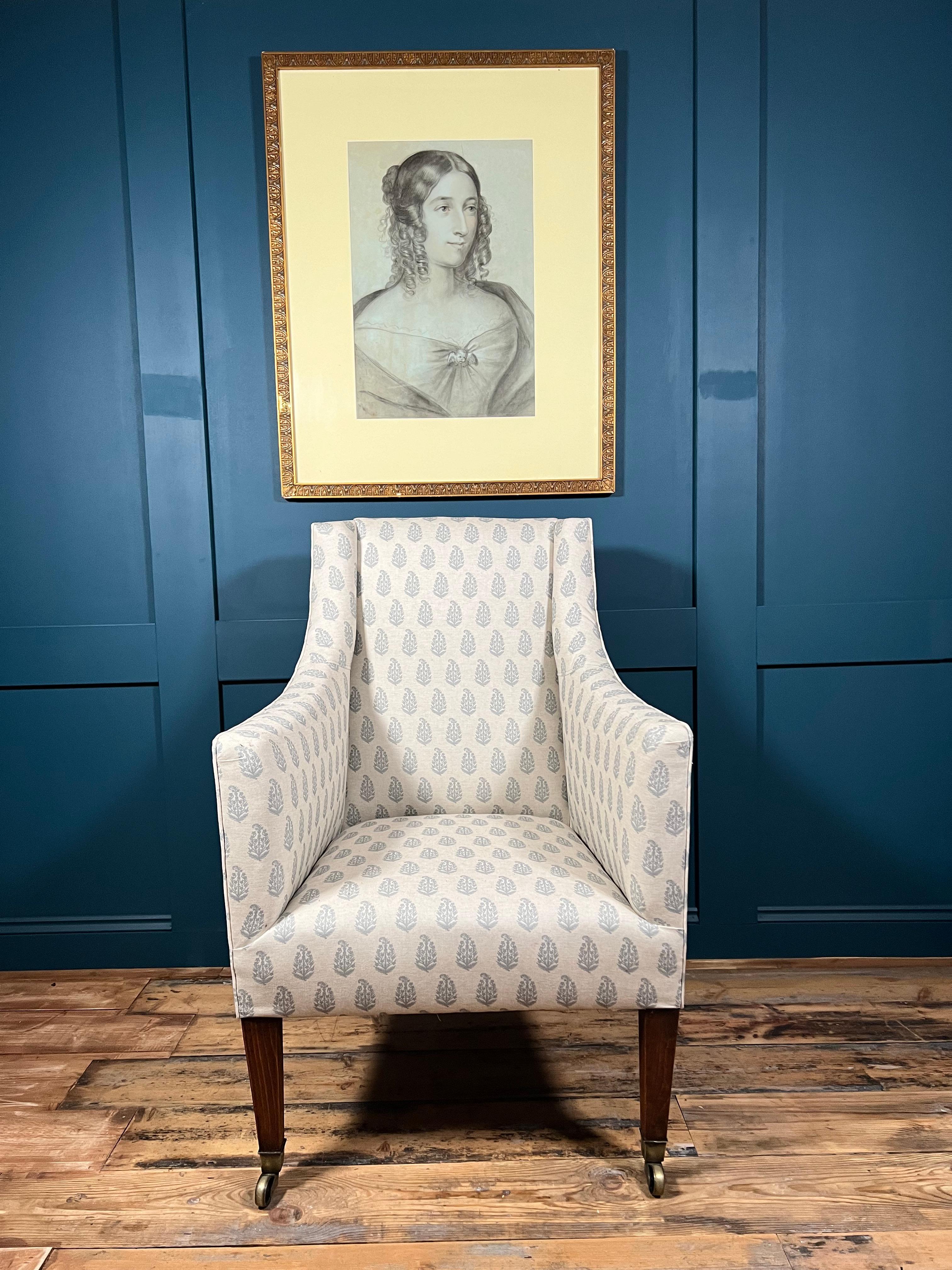 Experience the grandeur of the King George IV era, with this stunning Georgian Library Armchair. Crafted in the early 1820s, this piece is a true testament to the exceptional craftsmanship of the time. The chair features Oak square section legs,