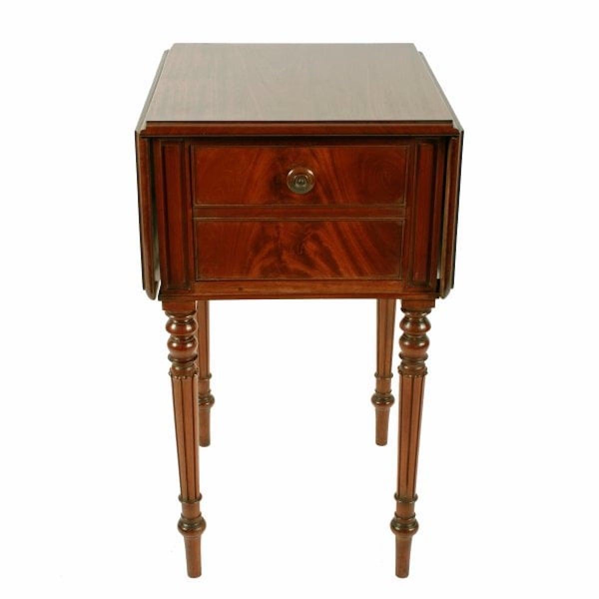 George IV Mahogany bedside cabinet

A George IV mahogany drop leaf bedside cabinet.

The cabinet has a mock drawer front that falls forward to open and has a knob handle with a twist catch.

The drop leaves are supported by a hinged flap when