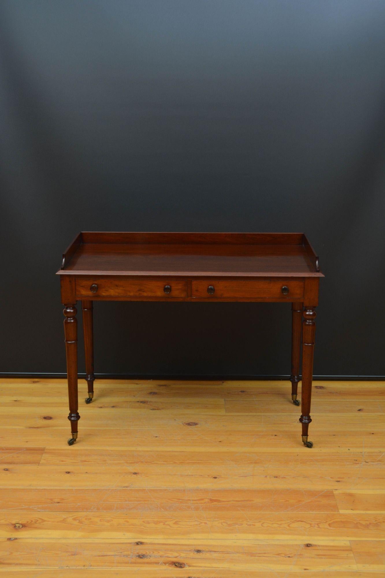 Sn5577 Fine quality and very elegant English Georgian mahogany writing table or dressing table, having shaped upstand, figured mahogany top with chamfered edge and two oak and mahogany lined drawers fitted with original turned knobs, all standing on