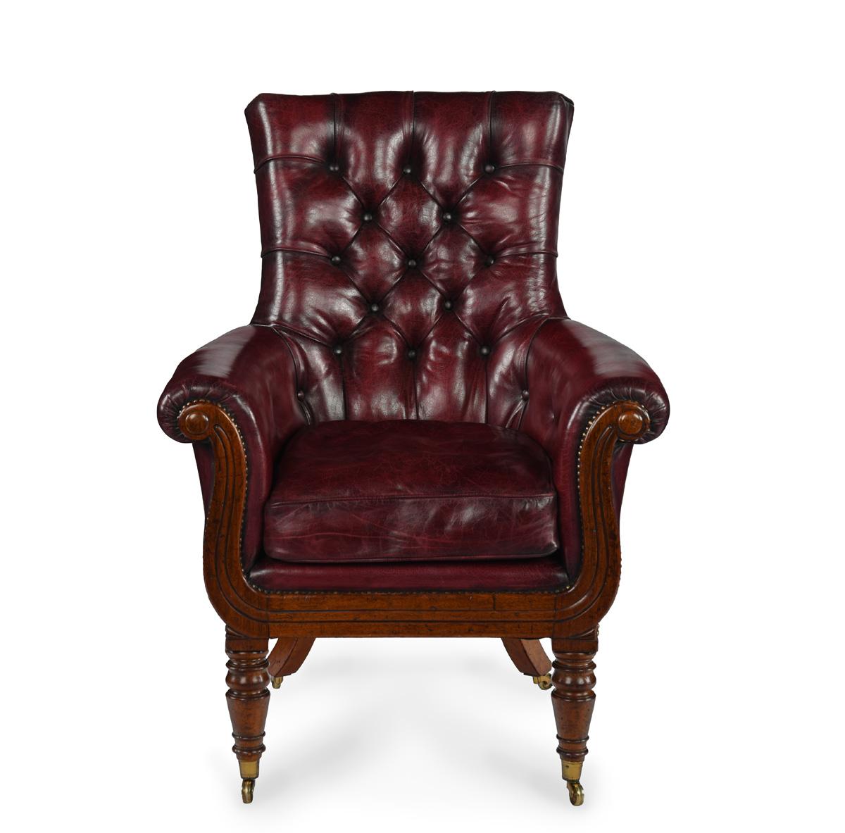 A George IV mahogany library chair with shaped arms on turned tapering legs.
Reupholstered in deep buttoned burgundy leather.
Circa 1820