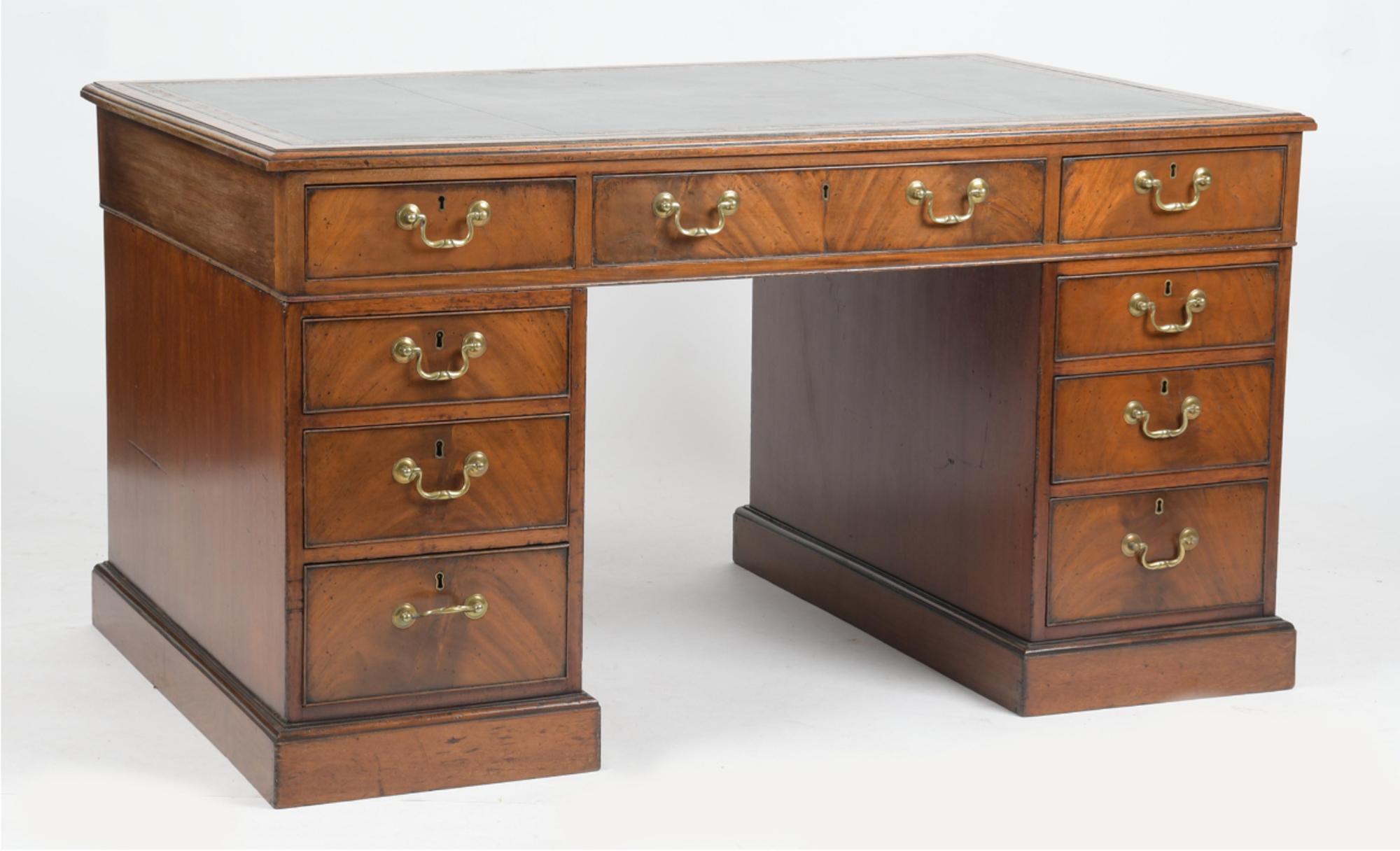 George IV Mahogany Pedestal Partners' Desk,
Circa 1830

The George Iv mahogany partner's desk has a molded rectangular top with a gilt tooled green leather inset writing surface above three frieze drawers to either side, with two banks of drawers of