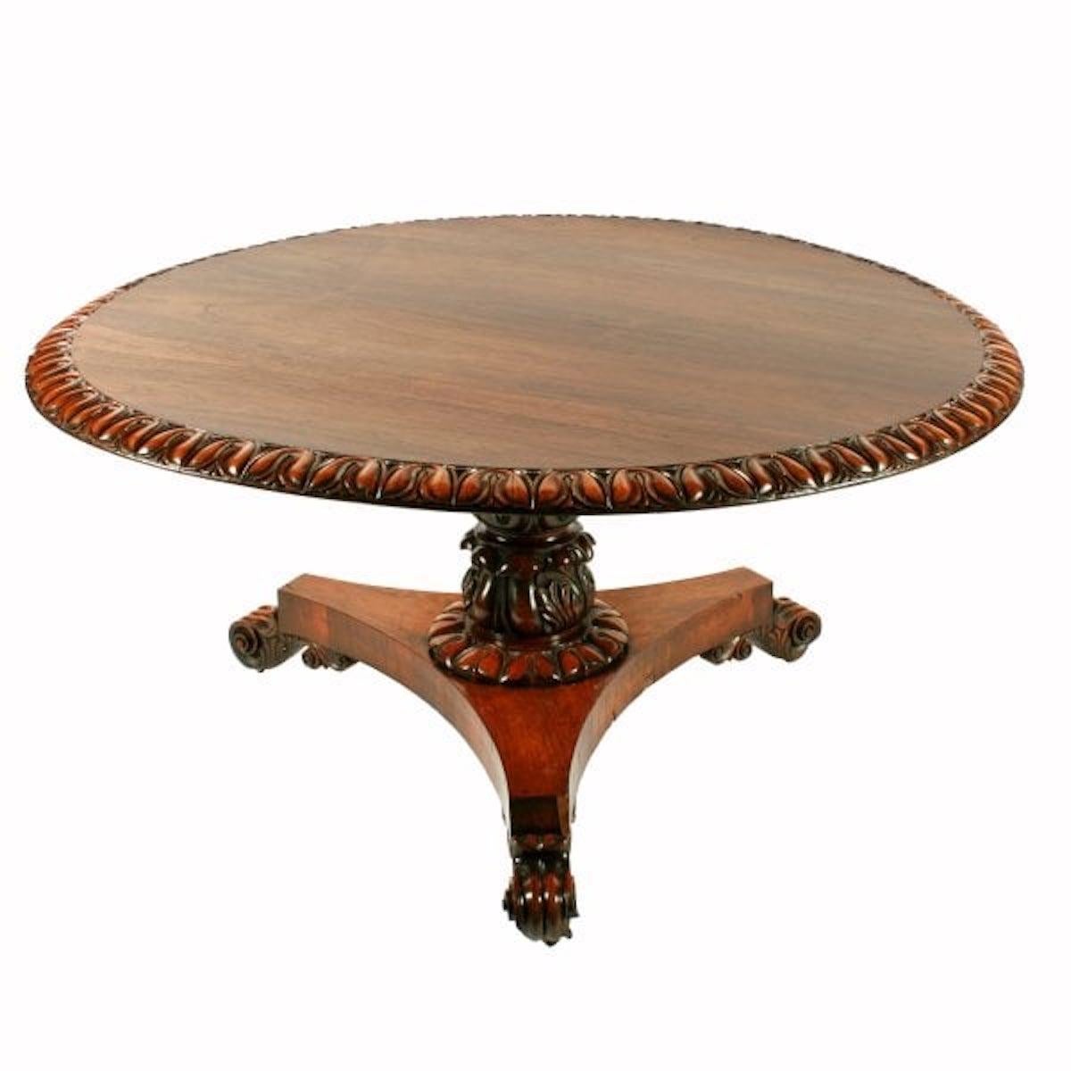 George IV rosewood centre table

A large early 19th century George IV rosewood centre or breakfast table.

The rosewood veneered circular top has a broad lappet carved edge and is held by pins in the base that allow the top to tip.

The