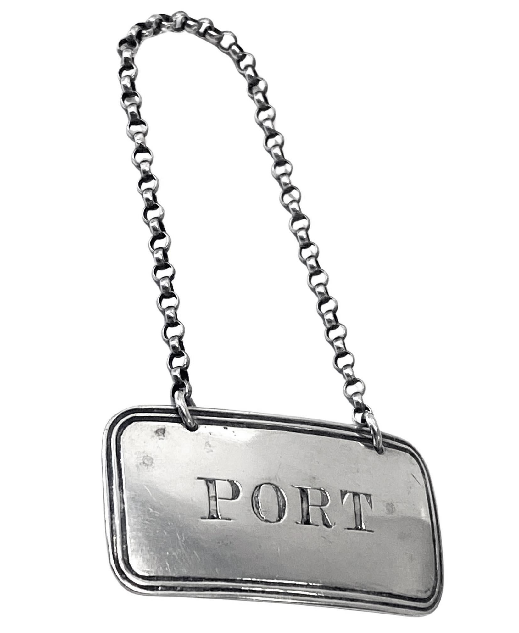 George IV silver Wine Label Port, English unmarked tested as sterling silver. The label of rounded rectangular form with gadrooned border, incised for Port. Measures: 1.80 x 1.00 