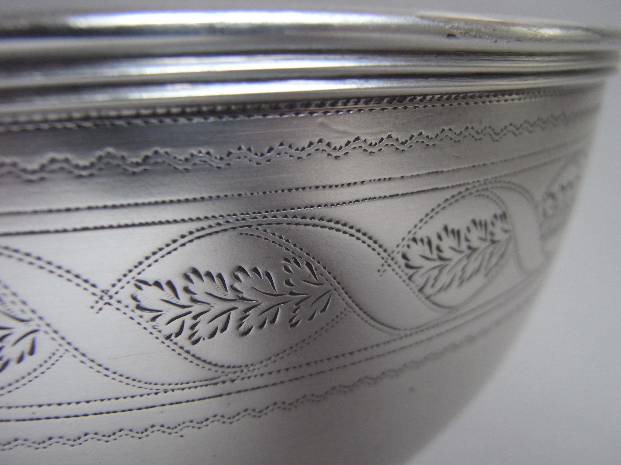 An Extremely Fine George IV Table Bowl, Most Probably for Fruit, Made in Edinburgh in 1829 by Leonard Urquhart.

The Bowl stands on a flared circular ring foot. The slightly baluster main body rises to a triple reeded rim above various wriggle work
