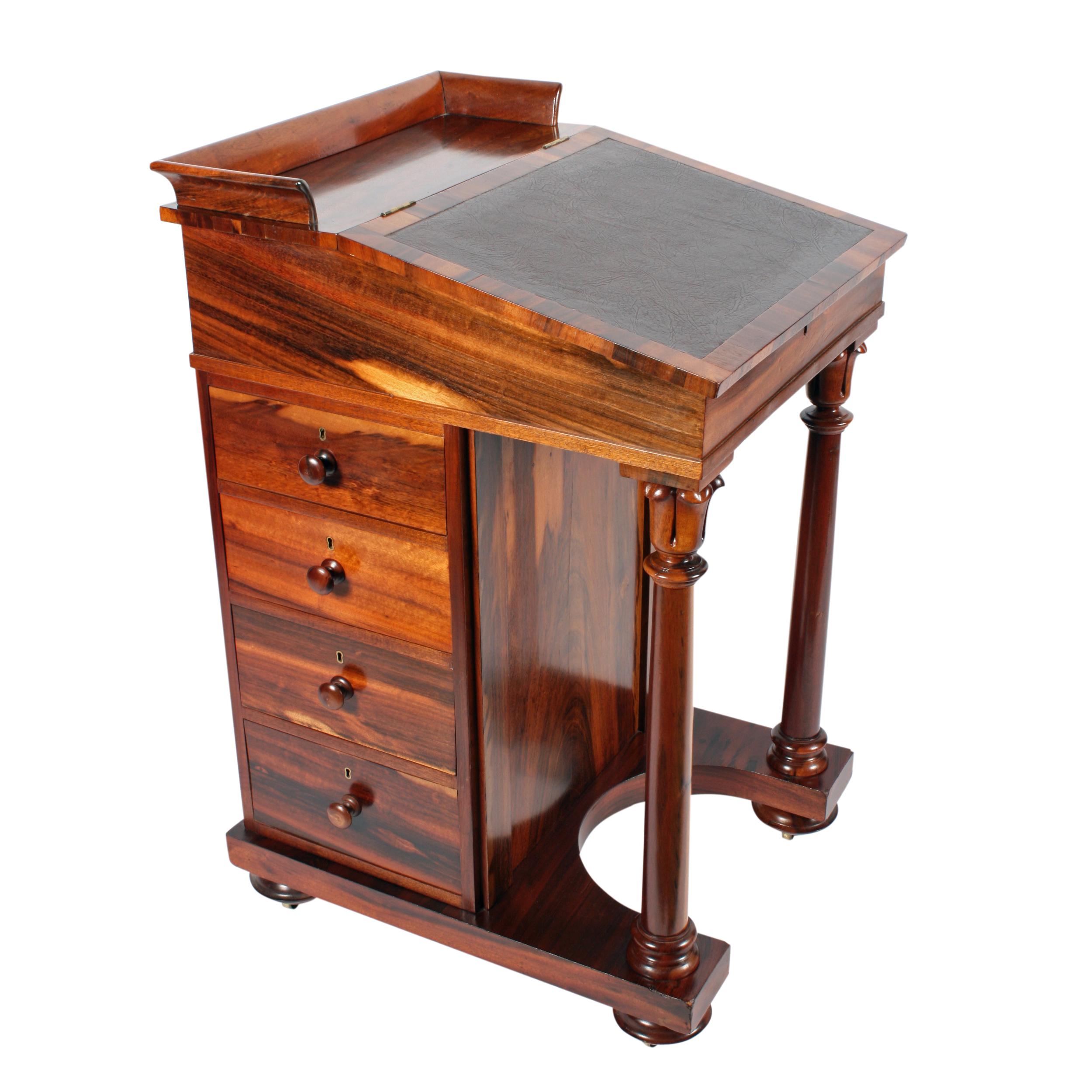 An early 19th century George IV zebra wood veneered mahogany lined Davenport desk.

The desk has four drawers with knob handles to the right hand side with four dummy drawers to the left.

Above the drawers is a small pen and ink drawer which