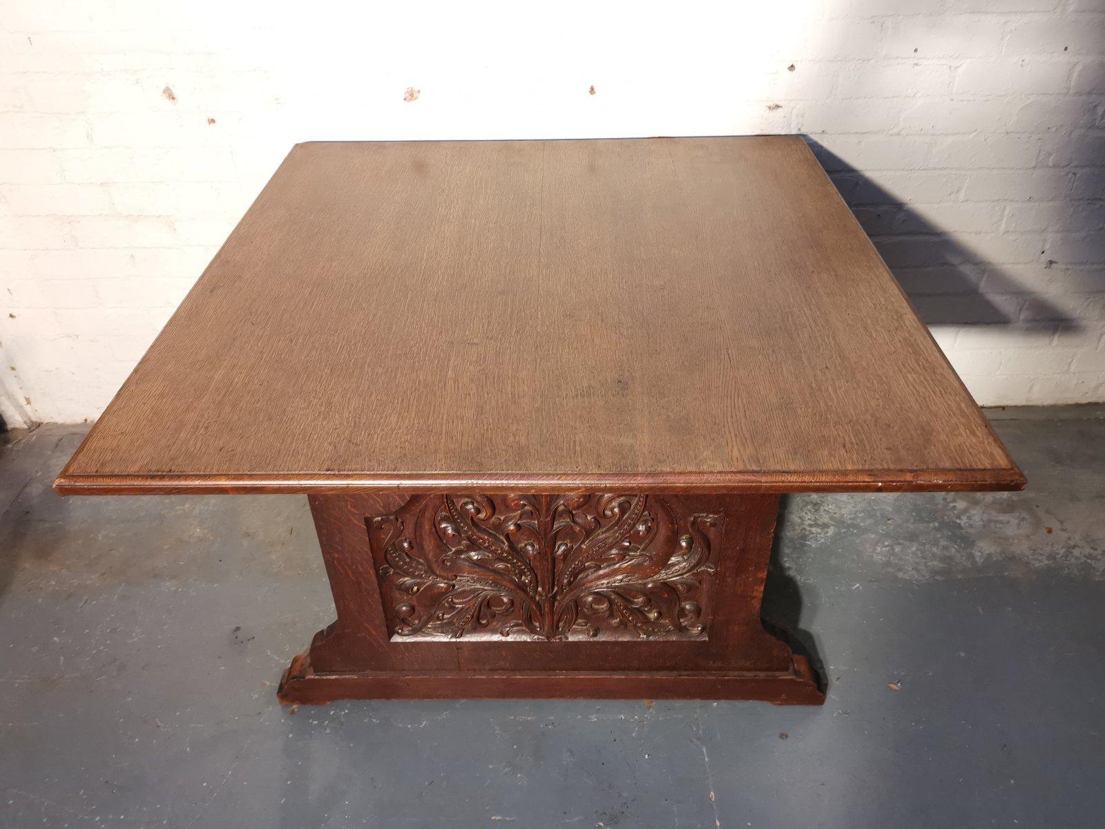 George Jack for Morris and Co. attributed.
An exceptional Arts and Crafts quarter-sawn oak library table/double desk, with a rectangular top and shaped sides united by a floor stretcher with molded details.
Each side with highly skilled carved