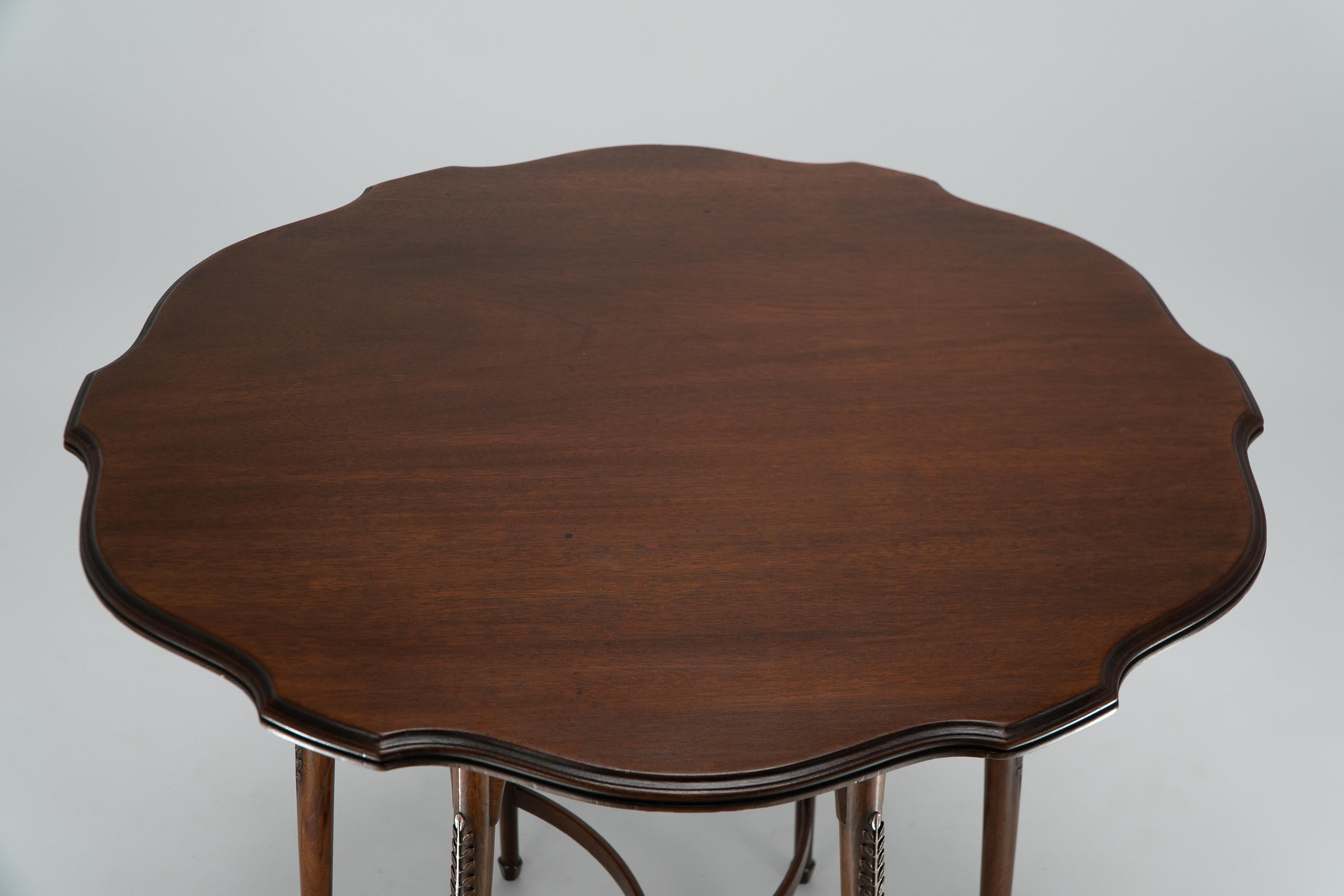 Mahogany George Jack for Morris and Co. A high Aesthetic Movement circular side table For Sale