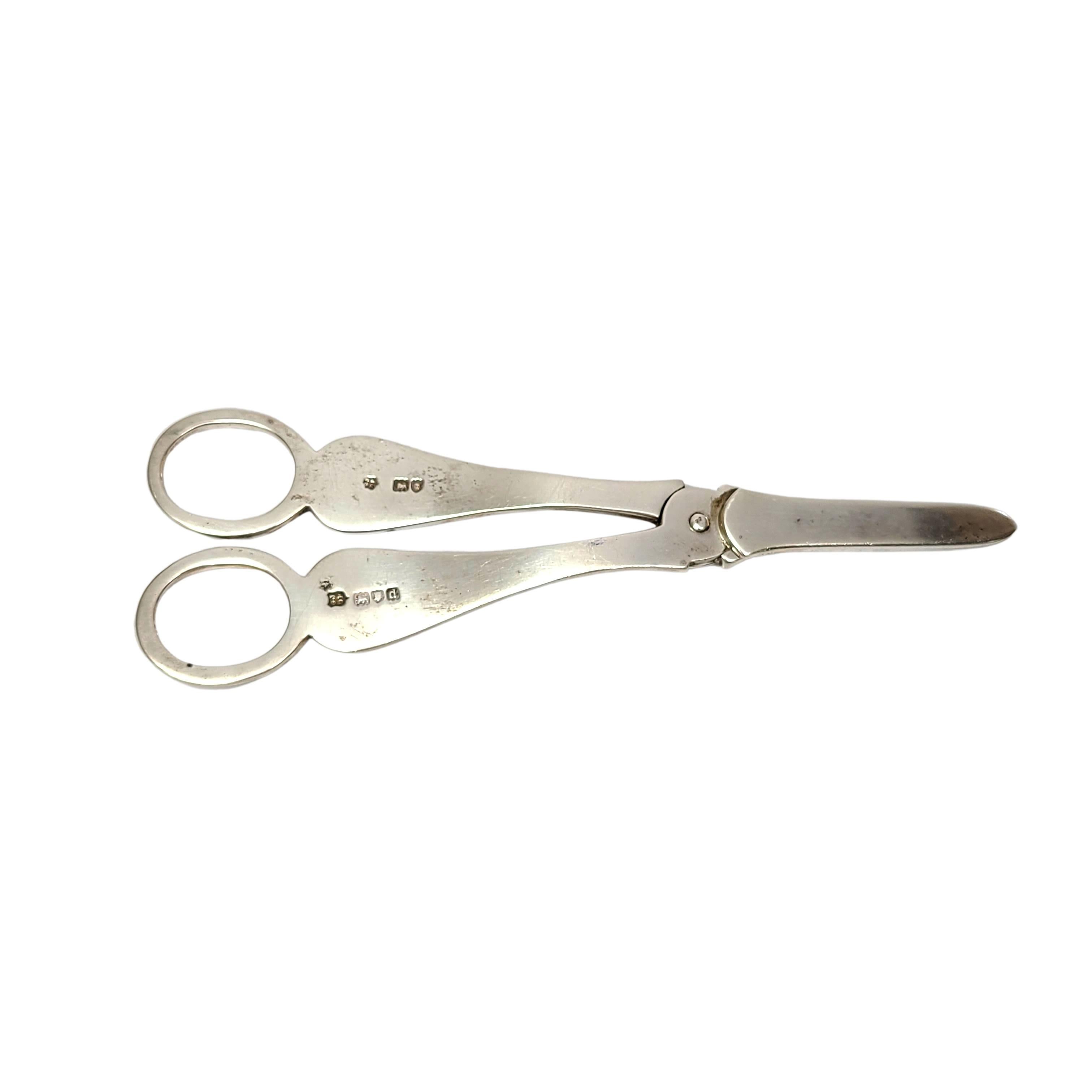 Sterling silver grape shears/scissors by George Jackson and David Fullerton of London, circa 1899.

Monograms appear to be THJ and 1900.

Features a bright cut etched design on one side, polished smooth rear side. Monograms are on oval cartouches,
