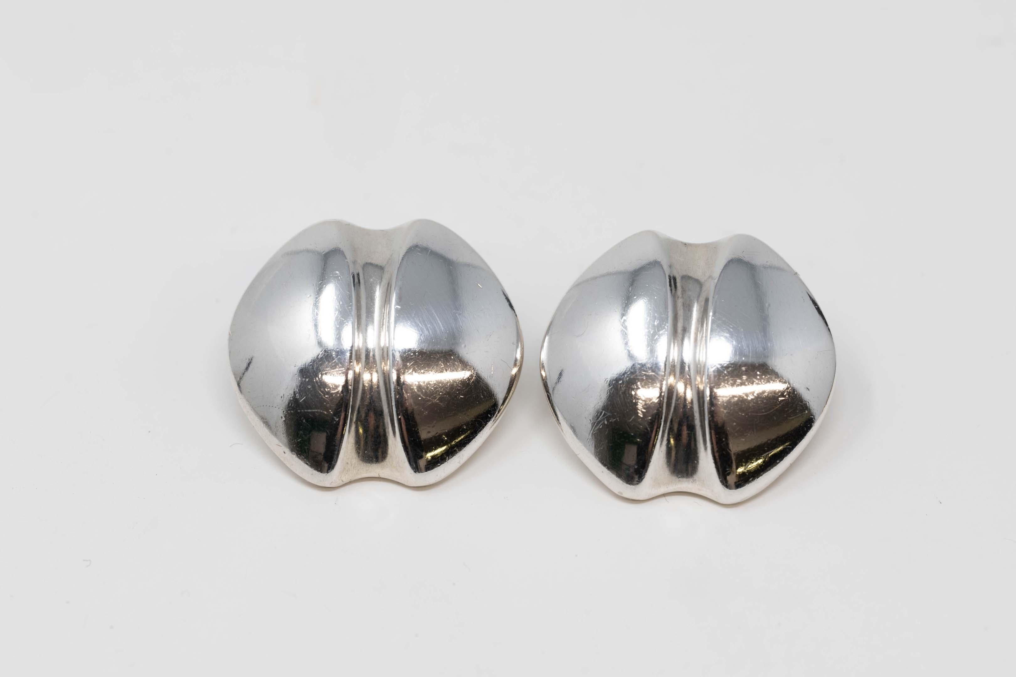 Sterling silver George Jensen clip-on earrings circa 1950 design by Henning Koppel. Very good condition, stamped on the back. Measures 1 inches x 1 inch. 
