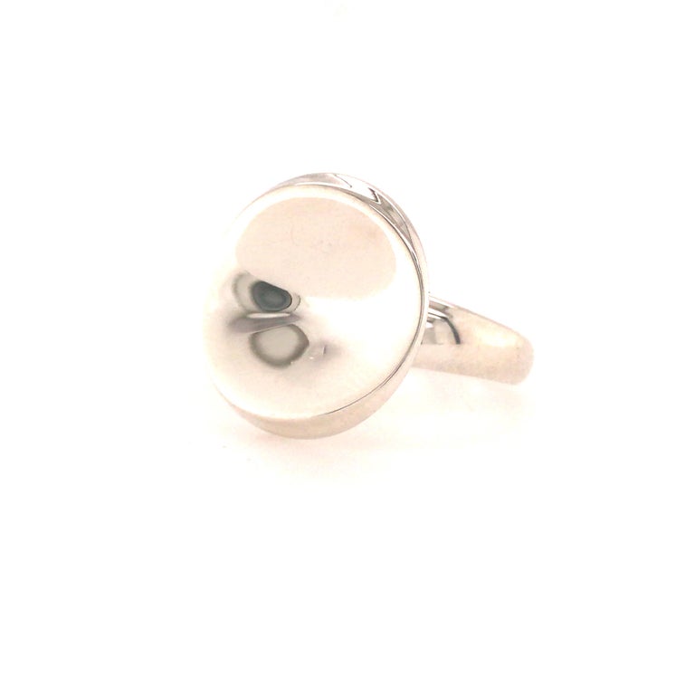 George Jensen Silver Ring with Round Top.  Ring size 6 1/2. 9.48 grams.  The Round accent top measures 3/4 inch in diameter.  Signed.  Stamped with trademark, 