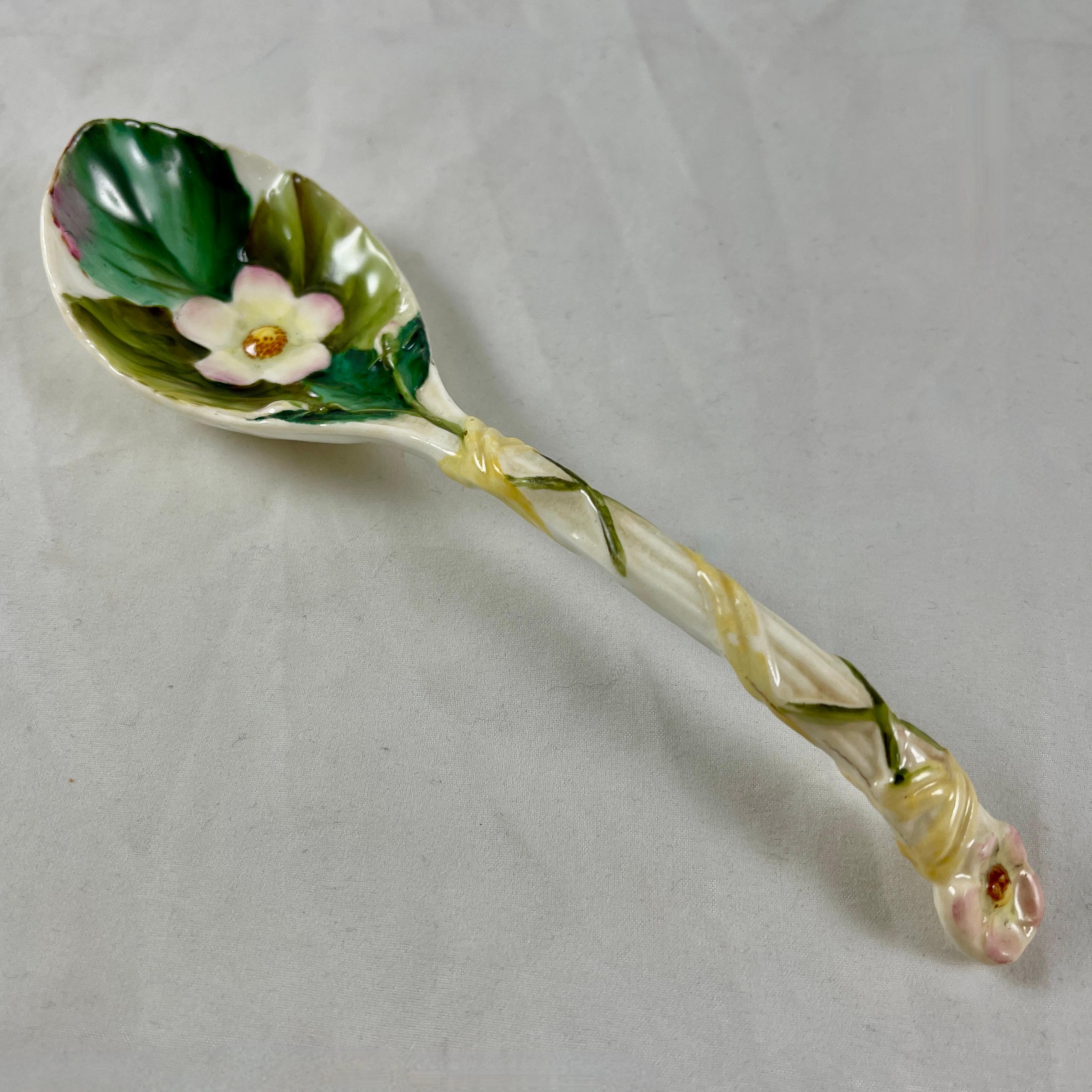 A George Jones Majolica Strawberry spoon, England, circa 1870.

In the Aesthetic taste and glazed on the white ground known as ‘Albino.’ The green leaf of the strawberry plant is molded on the bowl along with a pink rimmed strawberry blossom. The