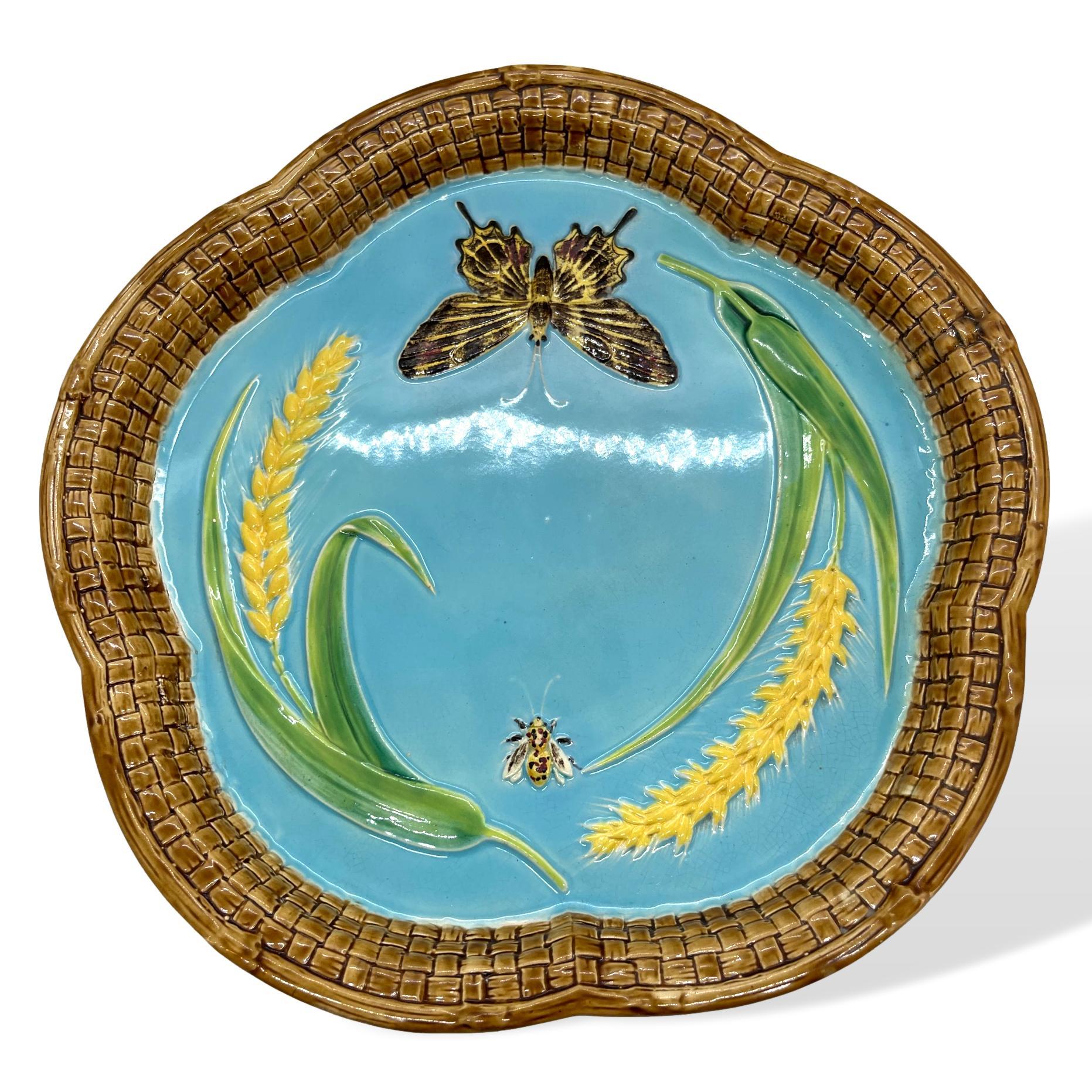 Impressed marks: 'GJ' monogram with crescent moon 'and Sons.' George Jones majolica date code 'C' for 1877 and painted design number '3477,' which corresponds to the entry 'Butterfly & Wheat Sheaf Bread Tray' in the George Jones Majolica Pattern
