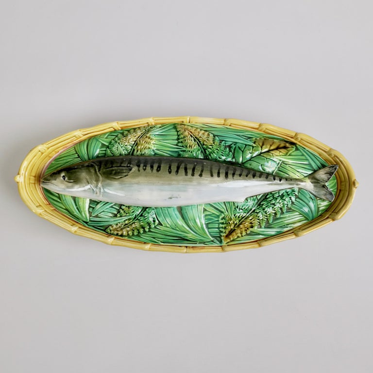This is a stunning fish tureen with cover made by George Jones in about 1875. The piece is made of majolica in the shape of a basket with a mackerel on the cover.
 
This tureen would make a wonderful centre piece to a Thanksgiving, Christmas or