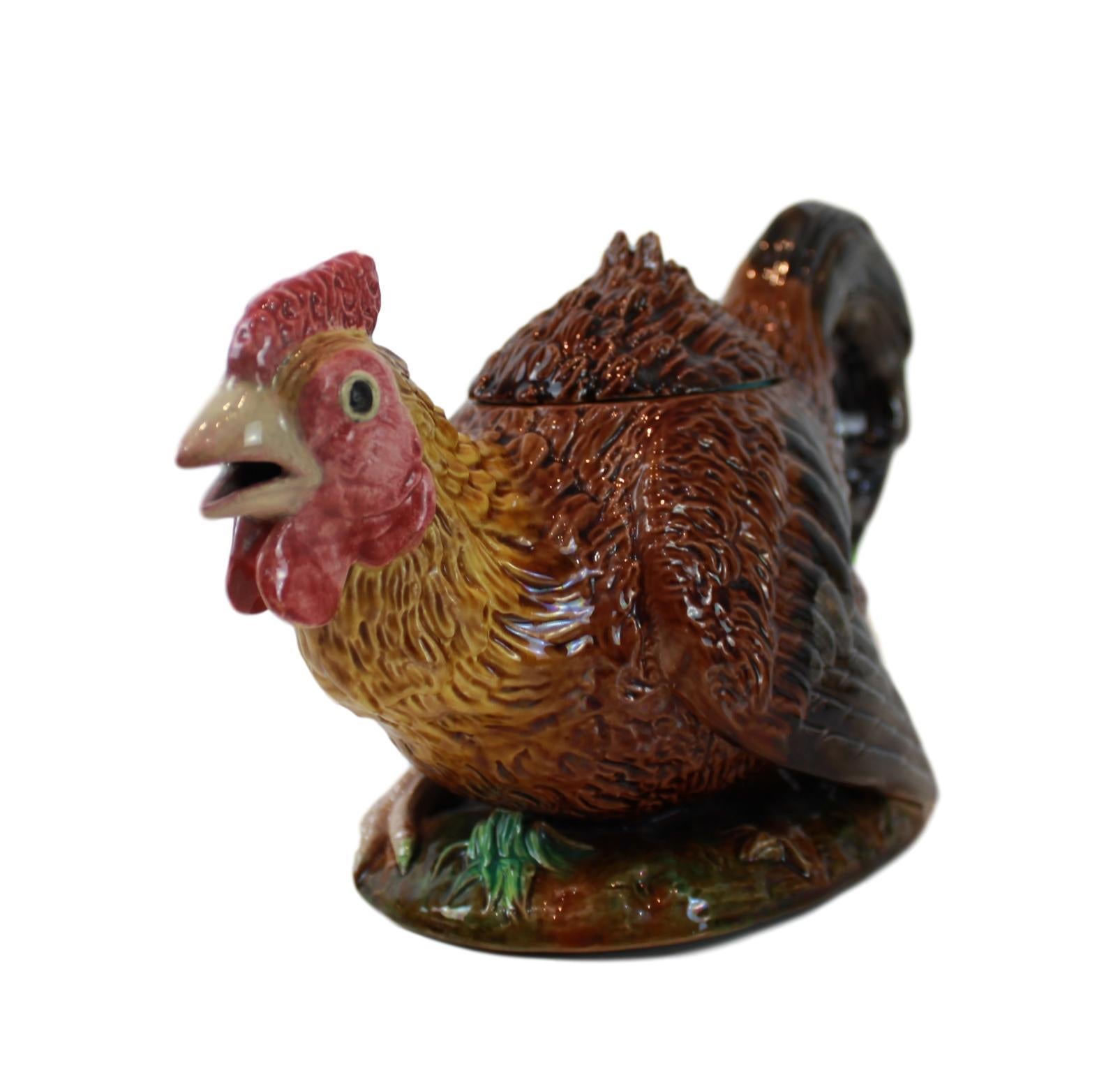 George Jones Majolica Rooster (Cockerel) teapot, English, dated 1872, naturalistically modeled as a running cockerel, the tail feathers forming a handle and the open beak, the spout. Richly glazed in brown, black, green, pink, red, and yellow, on a