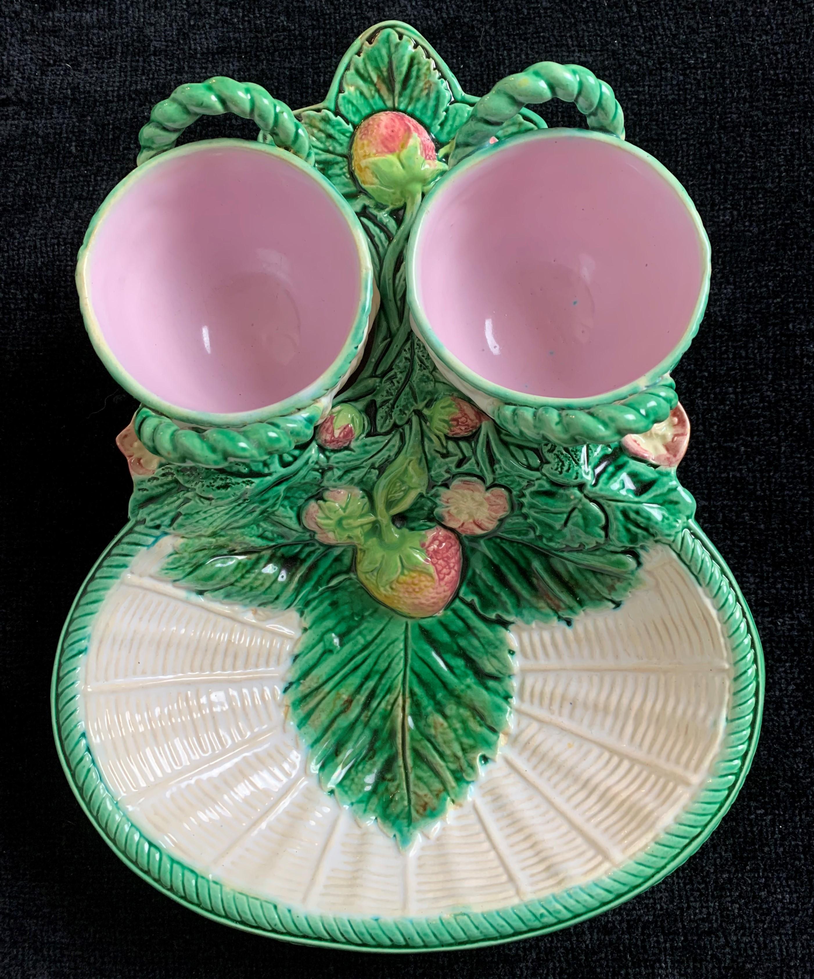 George Jones Majolica Strawberry server on white wicker ground with rare cream and sugar Baskets, English, circa 1868. Impressed British Registry Mark to reverse for 16 June 1868. This was one of the first majolica patterns registered by George