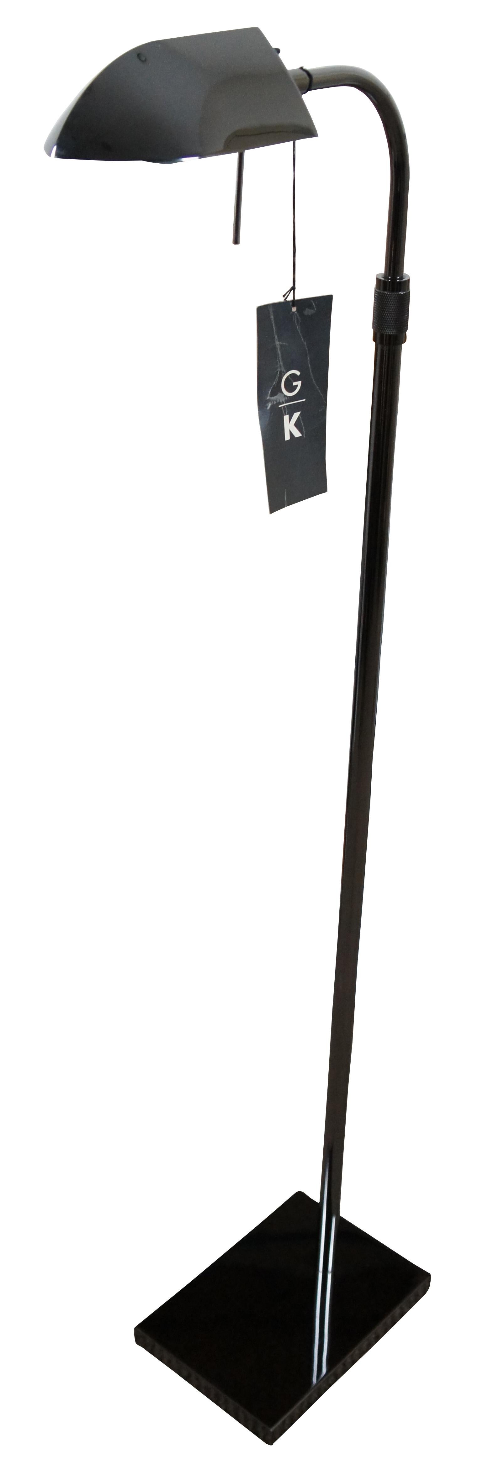 Vintage George Kovacs dark chrome modern pharmacy or library reading floor lamp with adjustable height and swivel head. Item number P603-1-605.

Measures: 14” x 6.25” x 43” / raises to 52