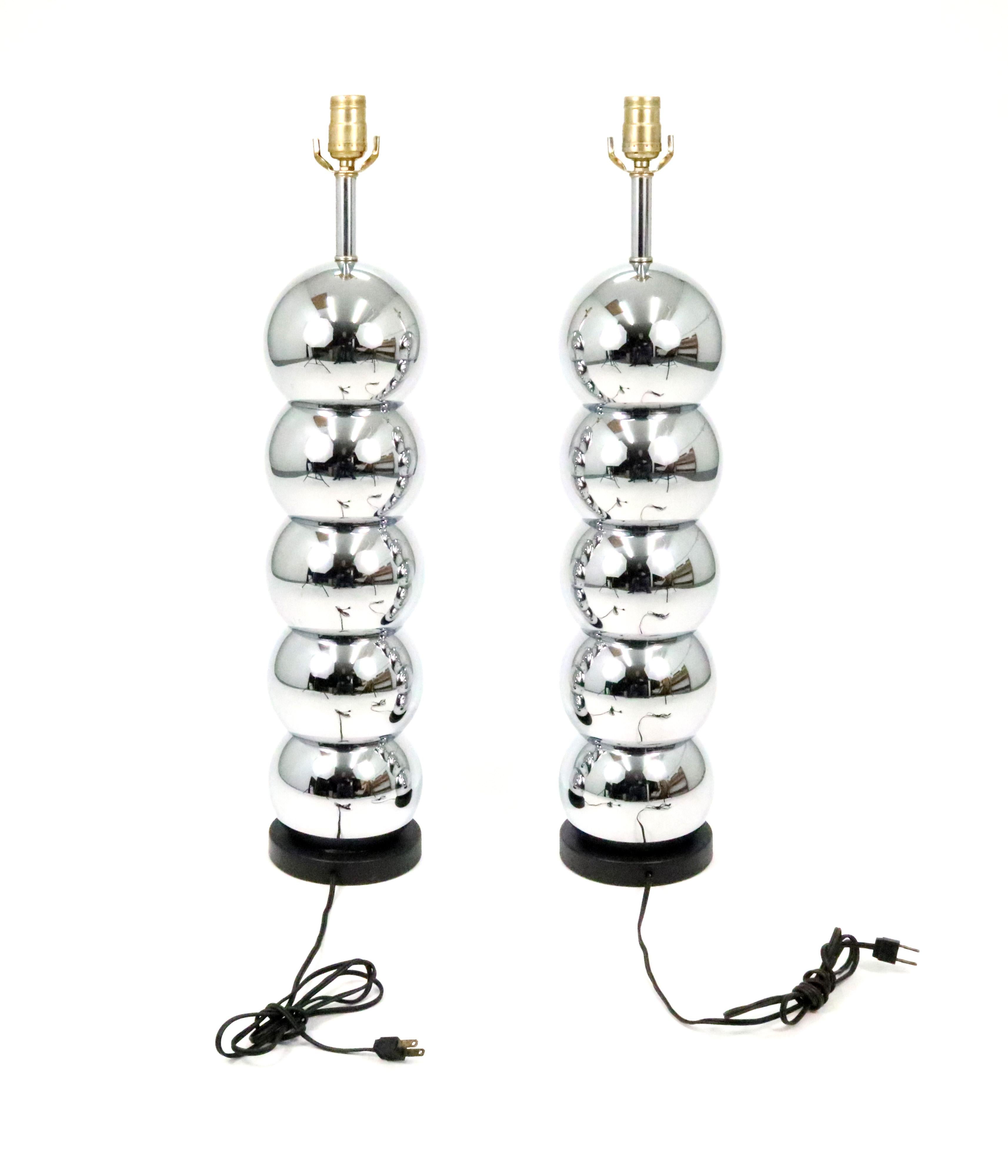 A handsome pair of 5-tier chrome ball lamps in the style of George Kovacs with black cloth shades.

Measure: 26
